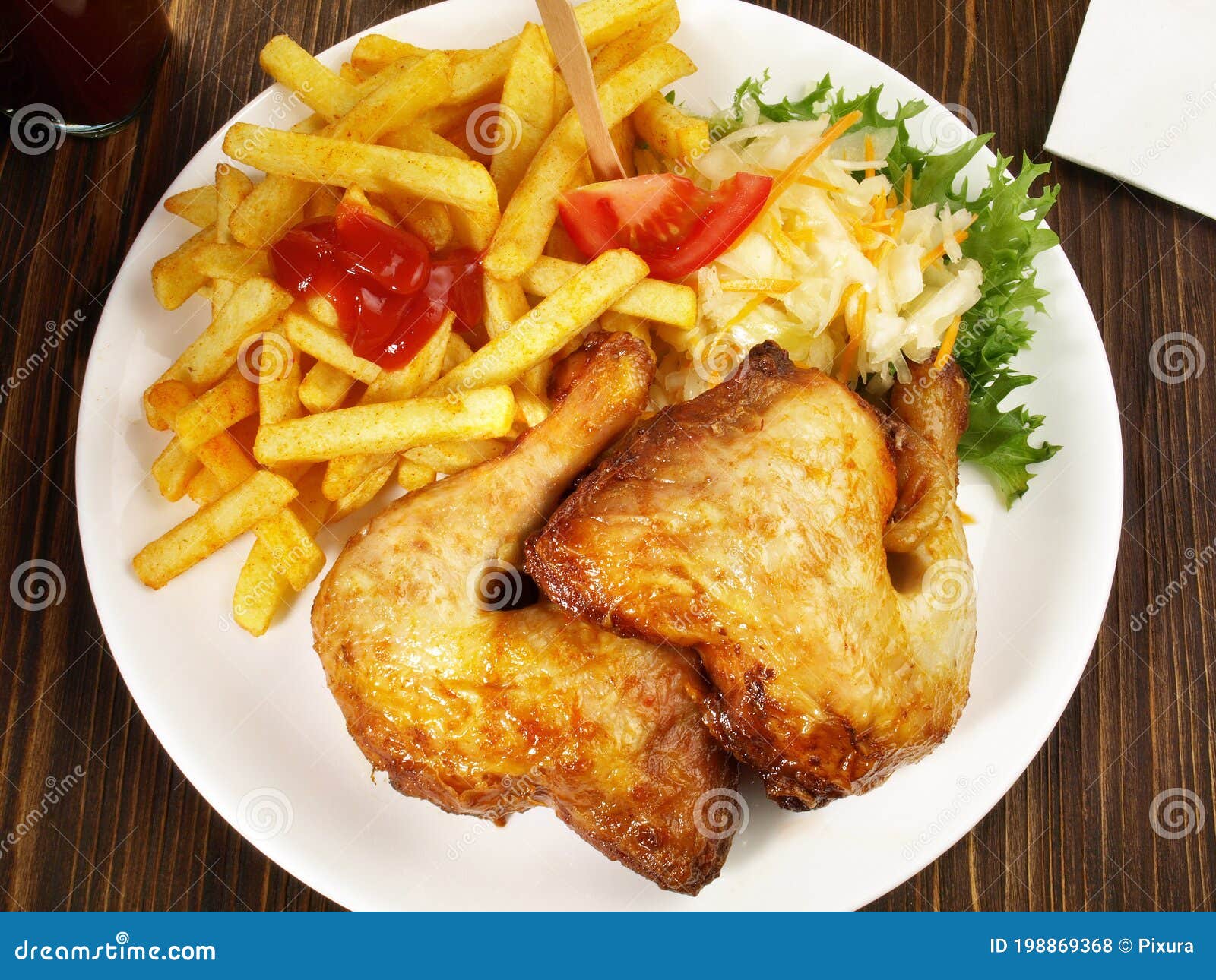Grilled Chicken Legs with French Fries and Coleslaw Salad Stock Photo ...