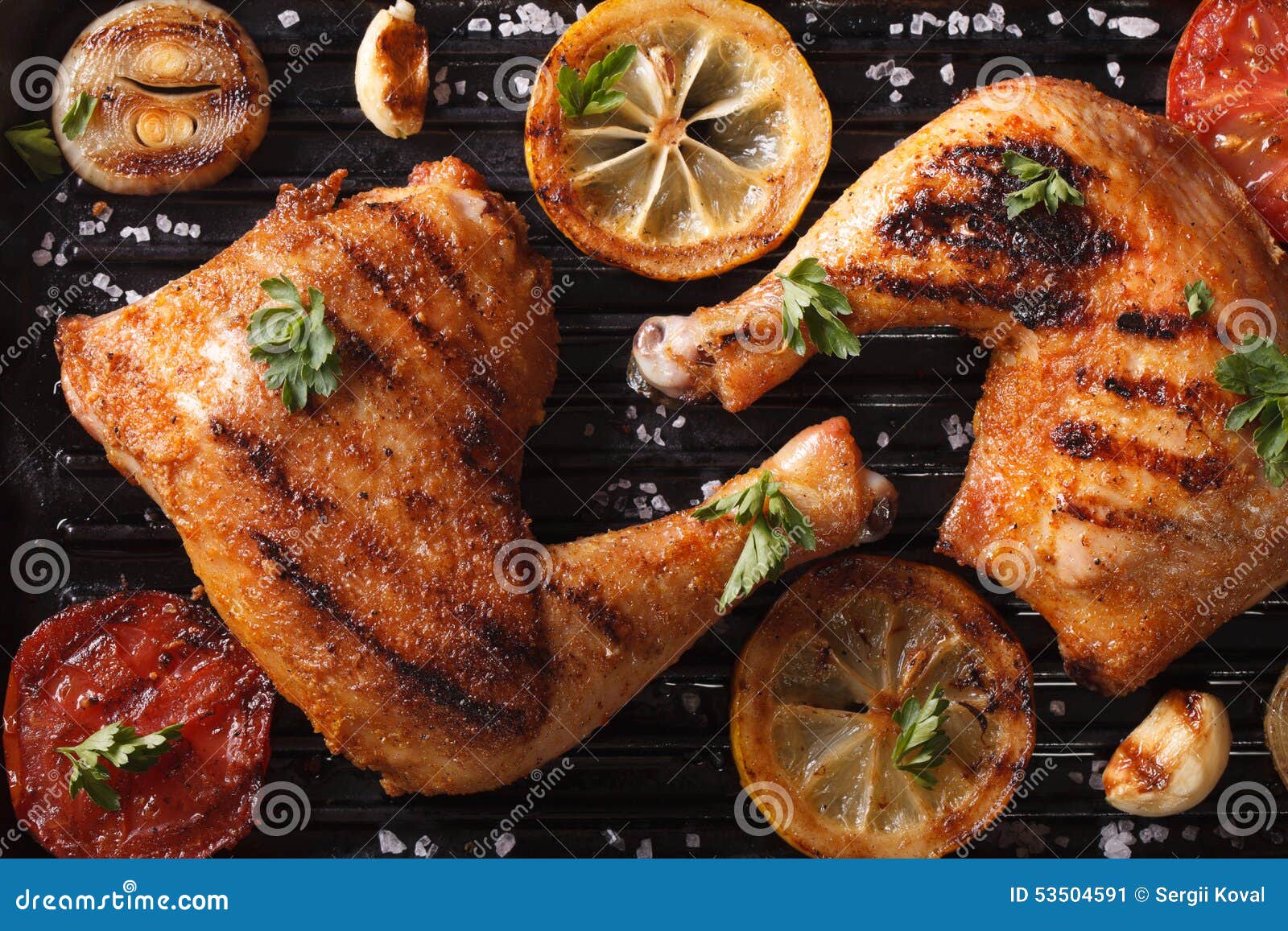 Chicken Legs and Vegetables on Grill Macro. Top View Horizontal Stock