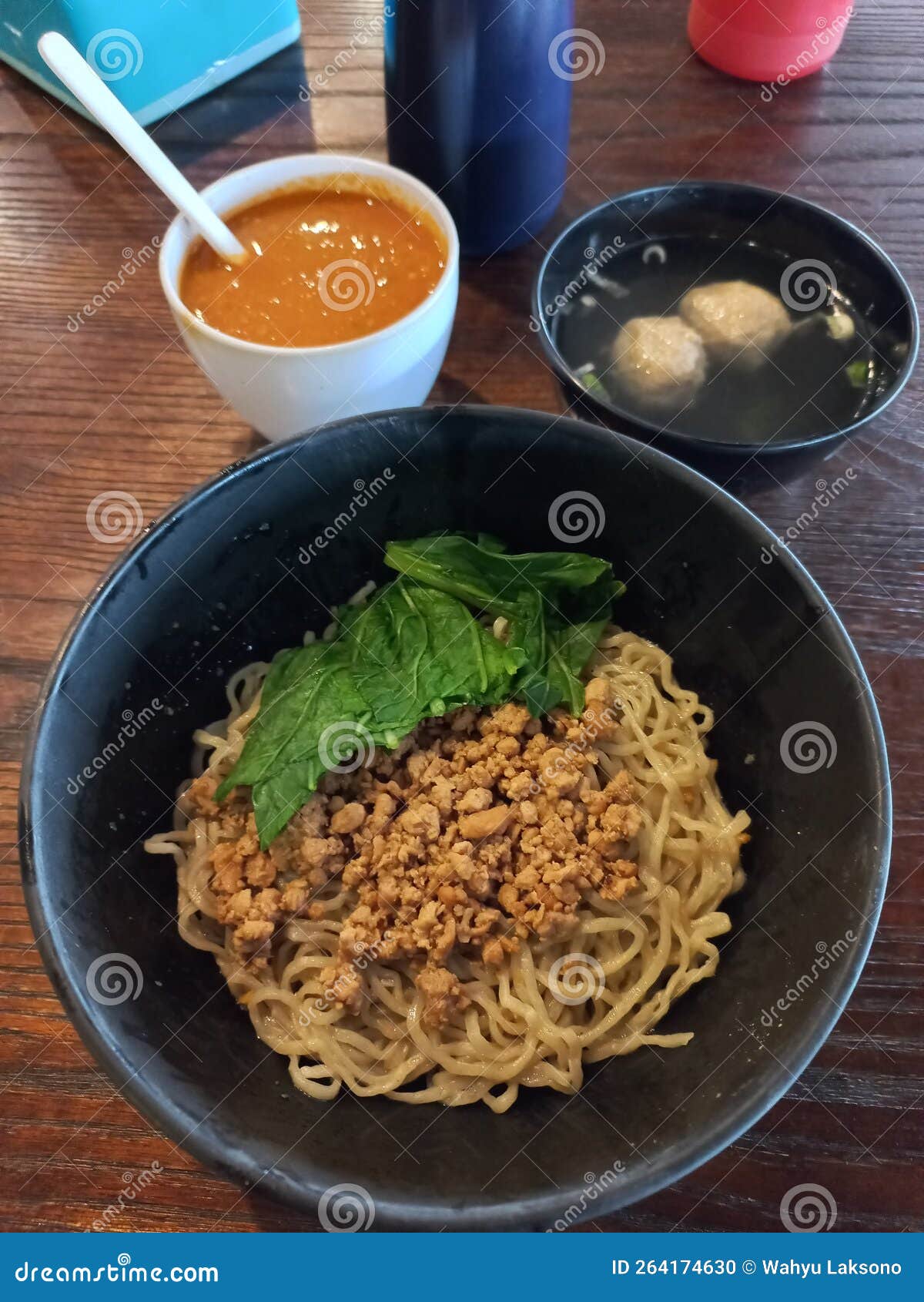 Chicken Noodle Sided with Meatball Soup and Chilli Sauce Stock Photo