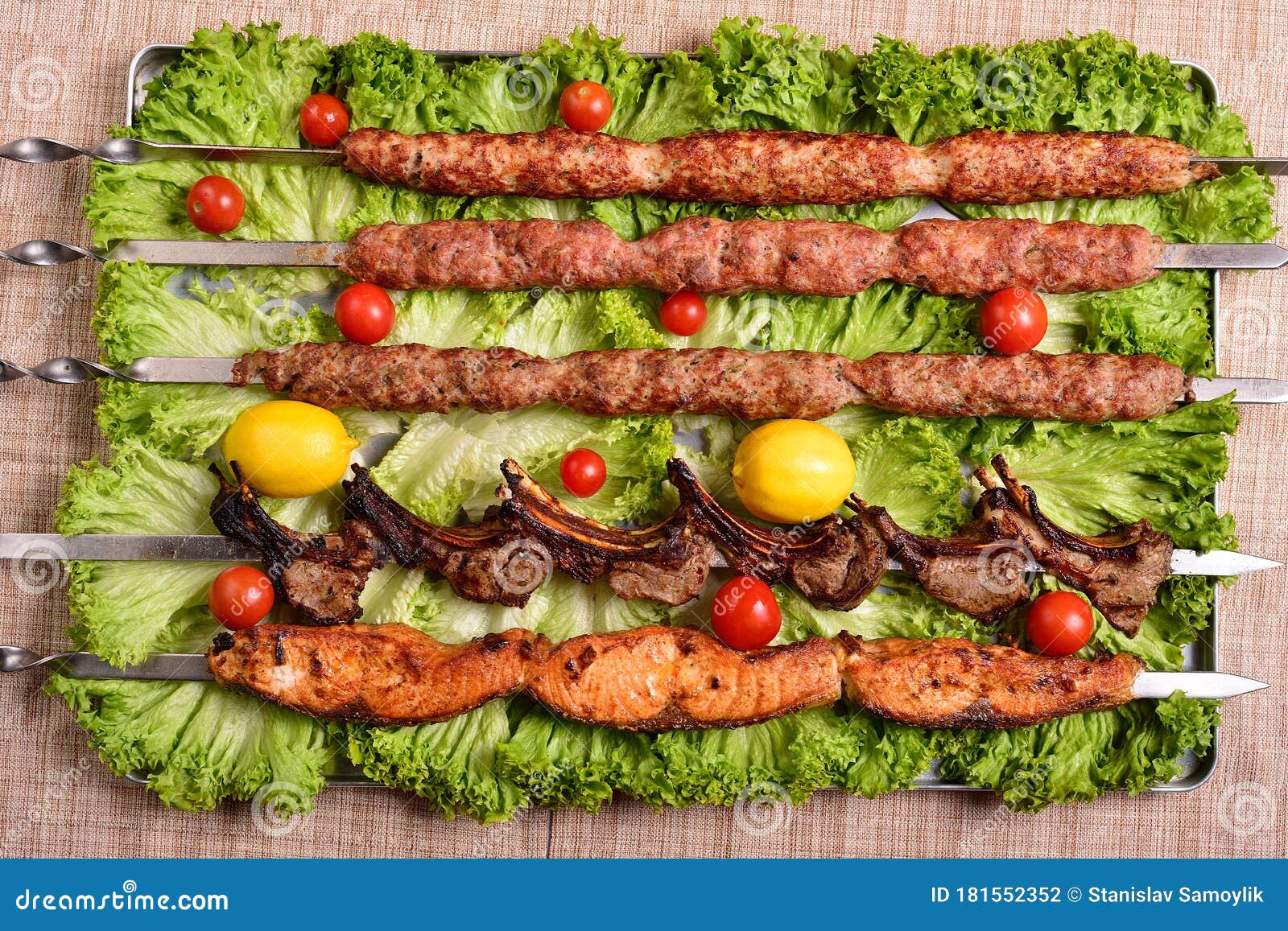 Chicken, Salmon and Meat Shish Kebabs on Parchment. Top View Stock