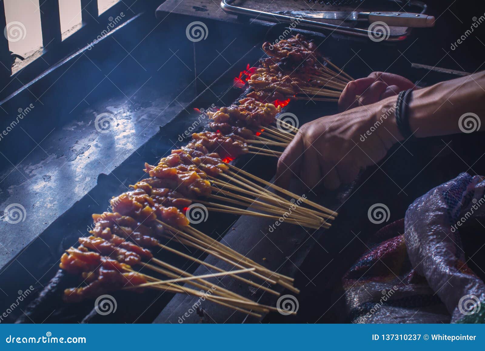 Chicken satay on the grill stock image. Image of barbecue 137310237