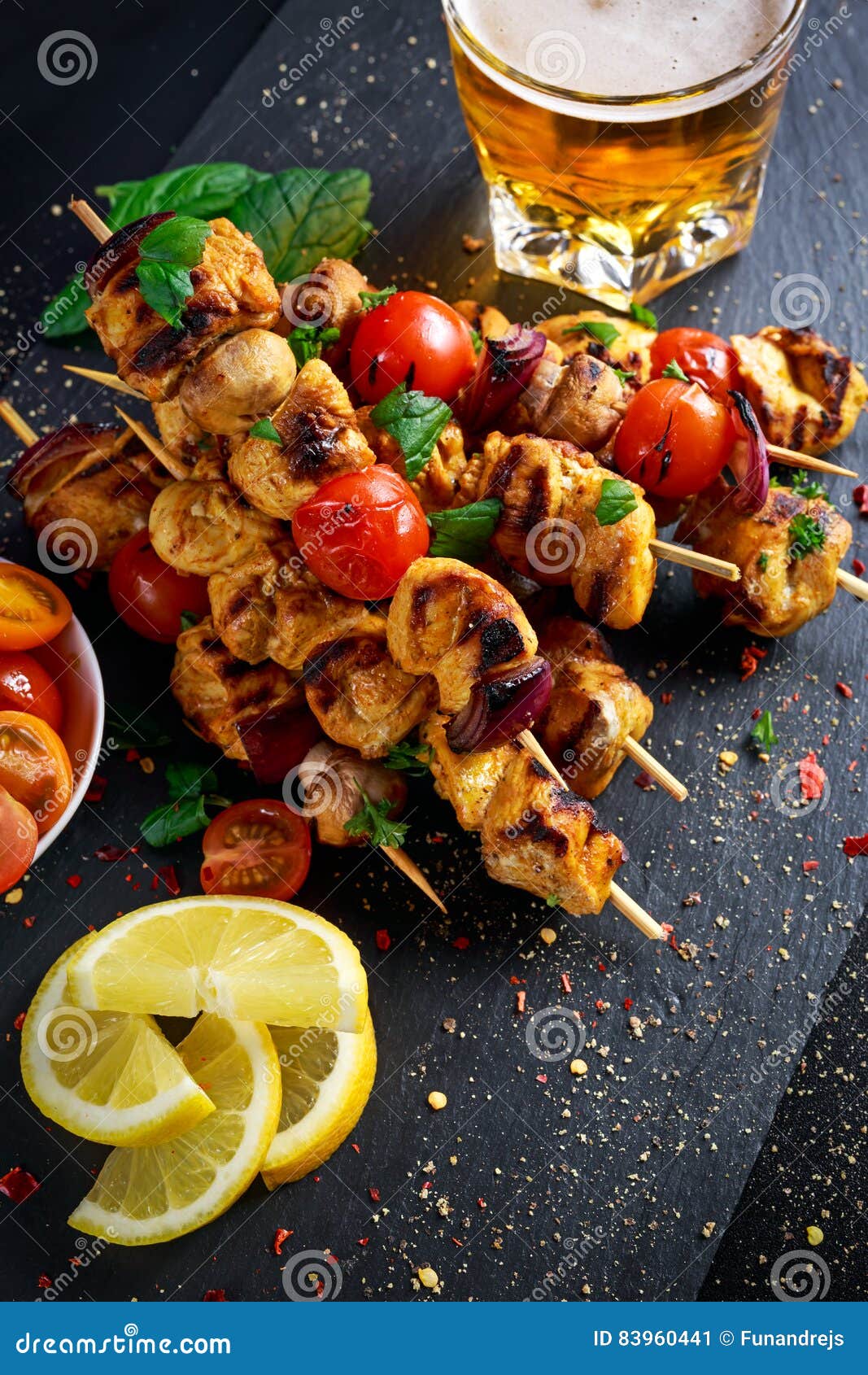 Chicken Skewers Marinated in Turmeric Yogurt Served with Lemon and Mint