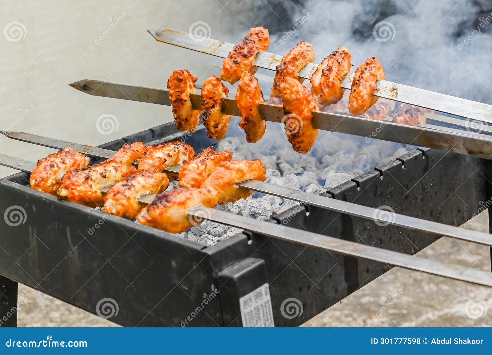 Mouthwatering Spicy Chicken Wings on the Skewers, London Stock Photo