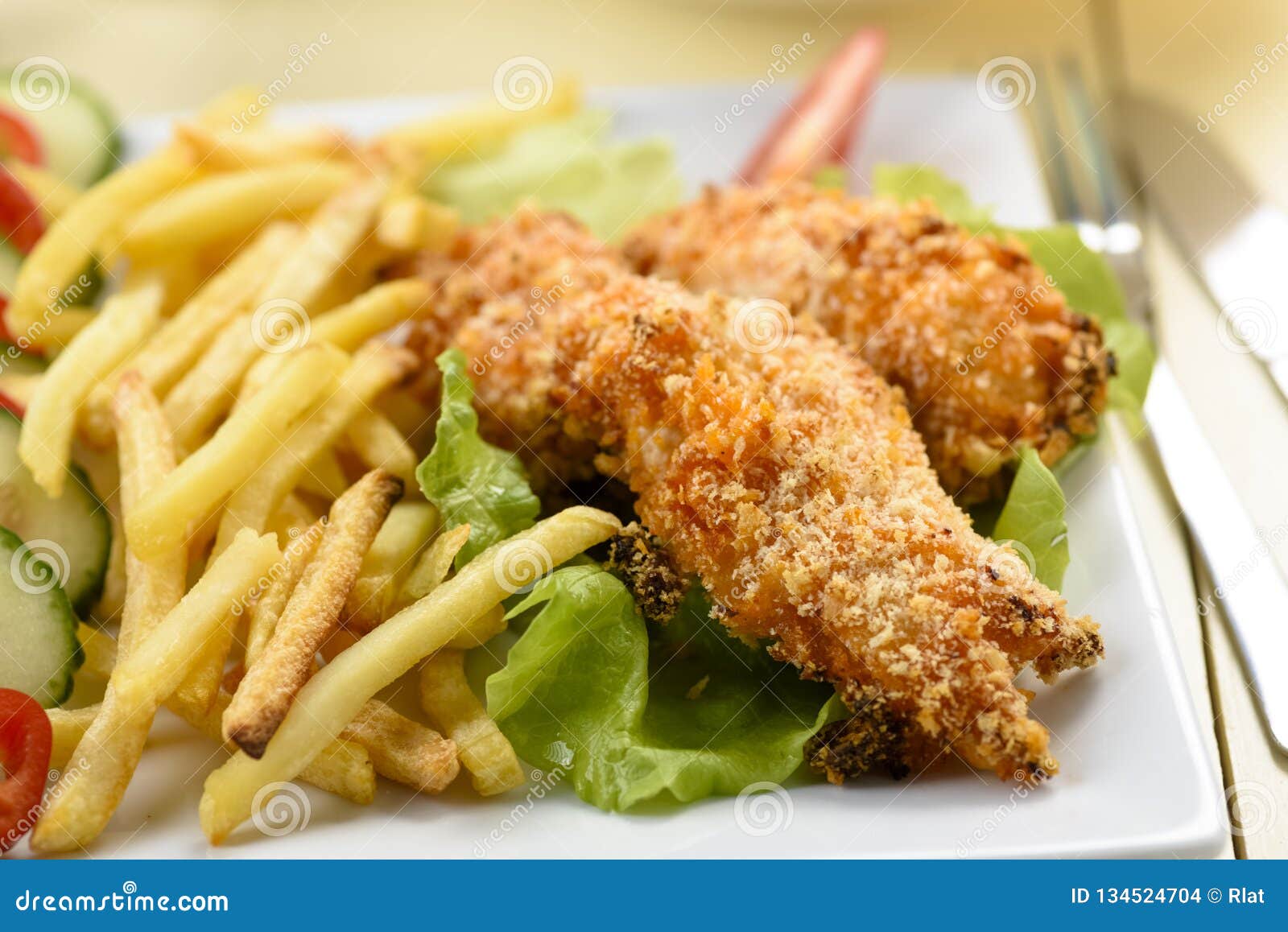 Chicken strips and fries stock photo. Image of bowl 134524704