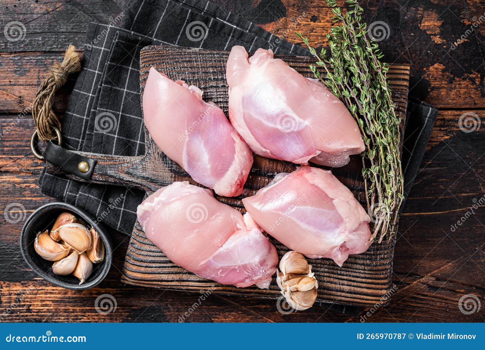 Chicken Thigh Fillet, Raw Boneless and Skinless Meat on a Cutting Board ...