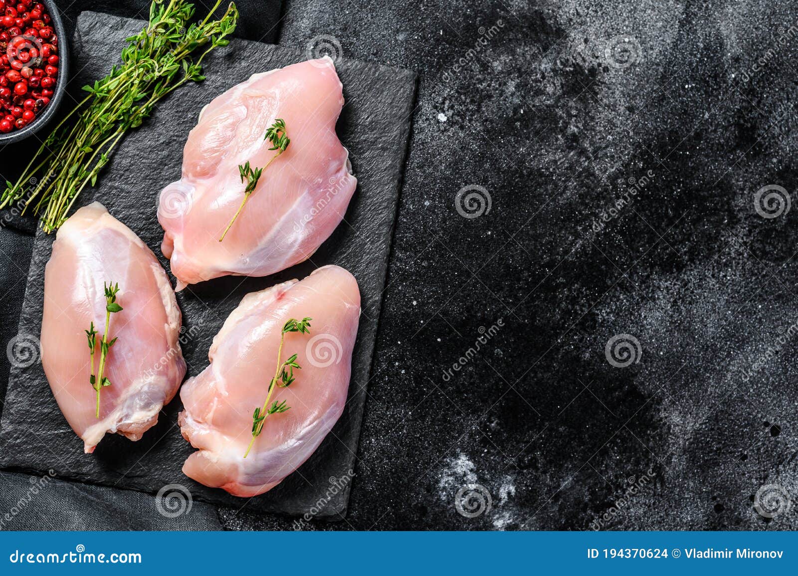 Chicken Thigh Fillet without Skin. Black Background. Top View Stock ...