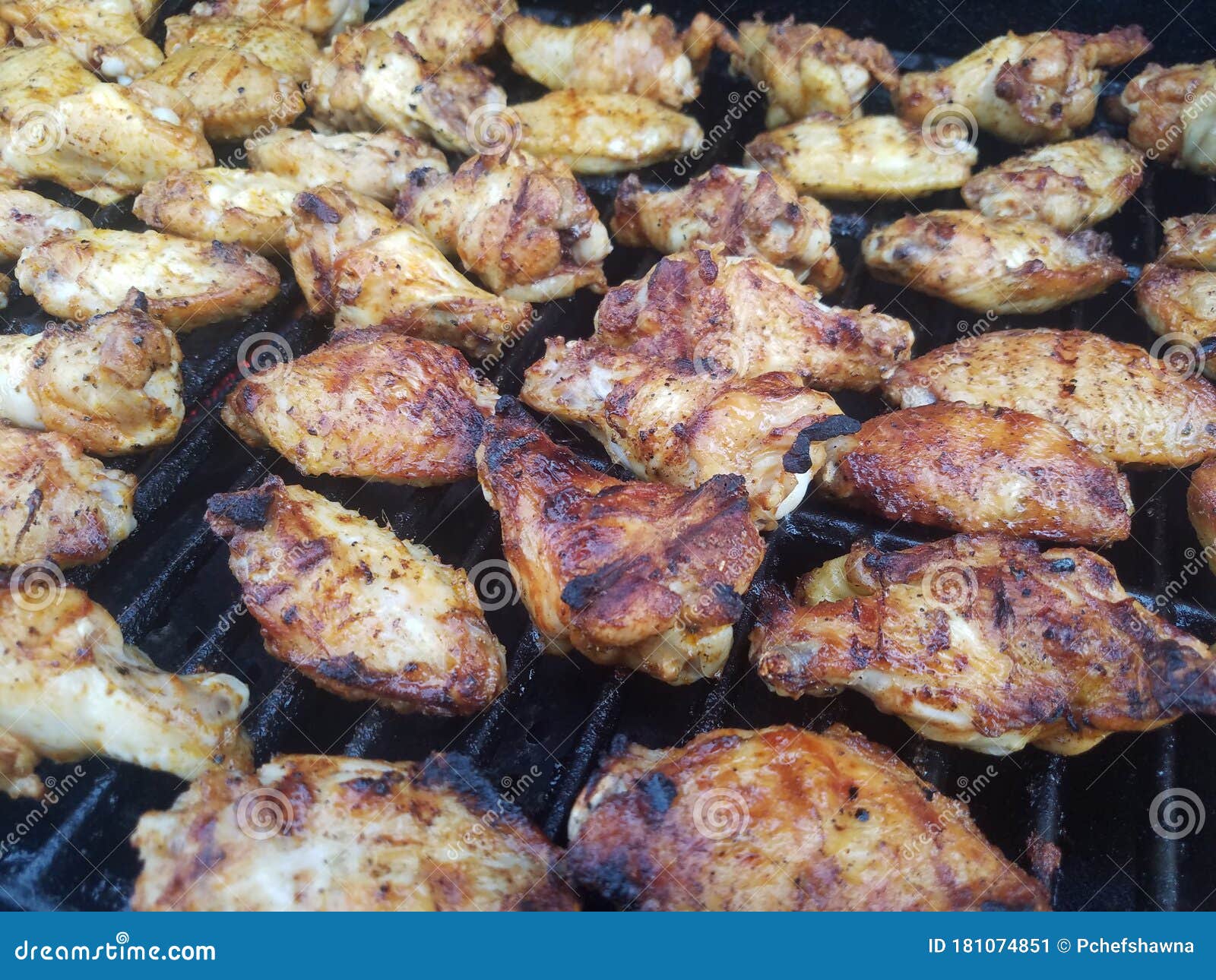 Chicken wings on the grill stock image. Image of delicious 181074851