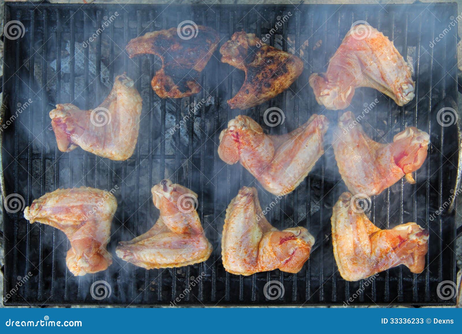 Chicken wings on the grill stock image. Image of coal 33336233