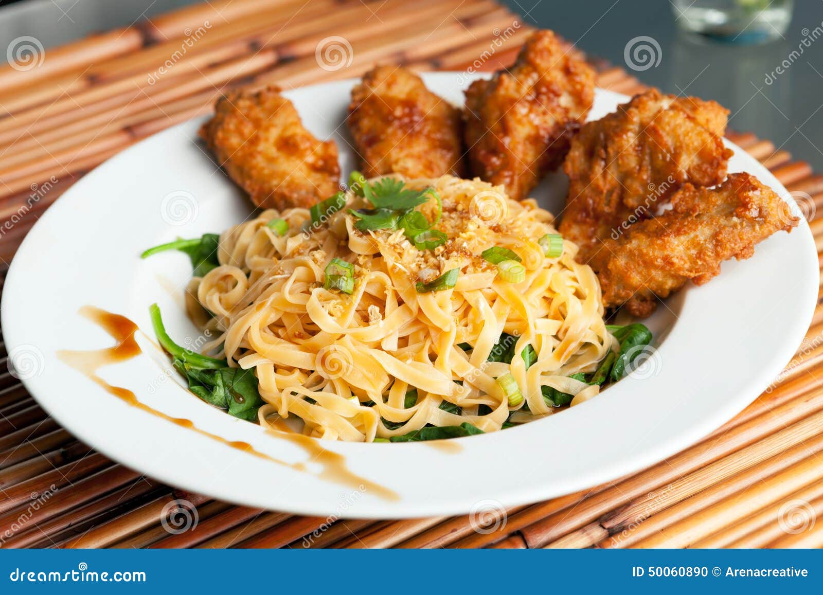 Chicken Wings with Noodles and Spinach Stock Photo Image of meal