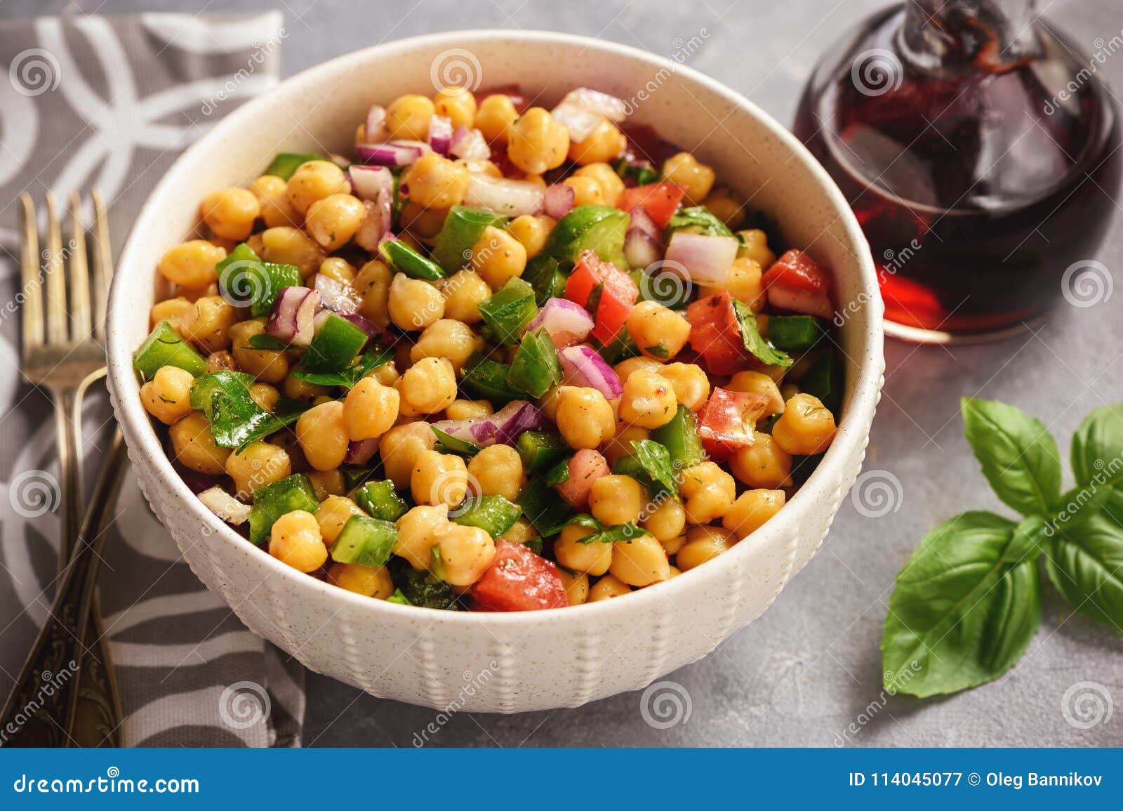 chickpea salad with green pepper, red onion and vinaigrette dressing.
