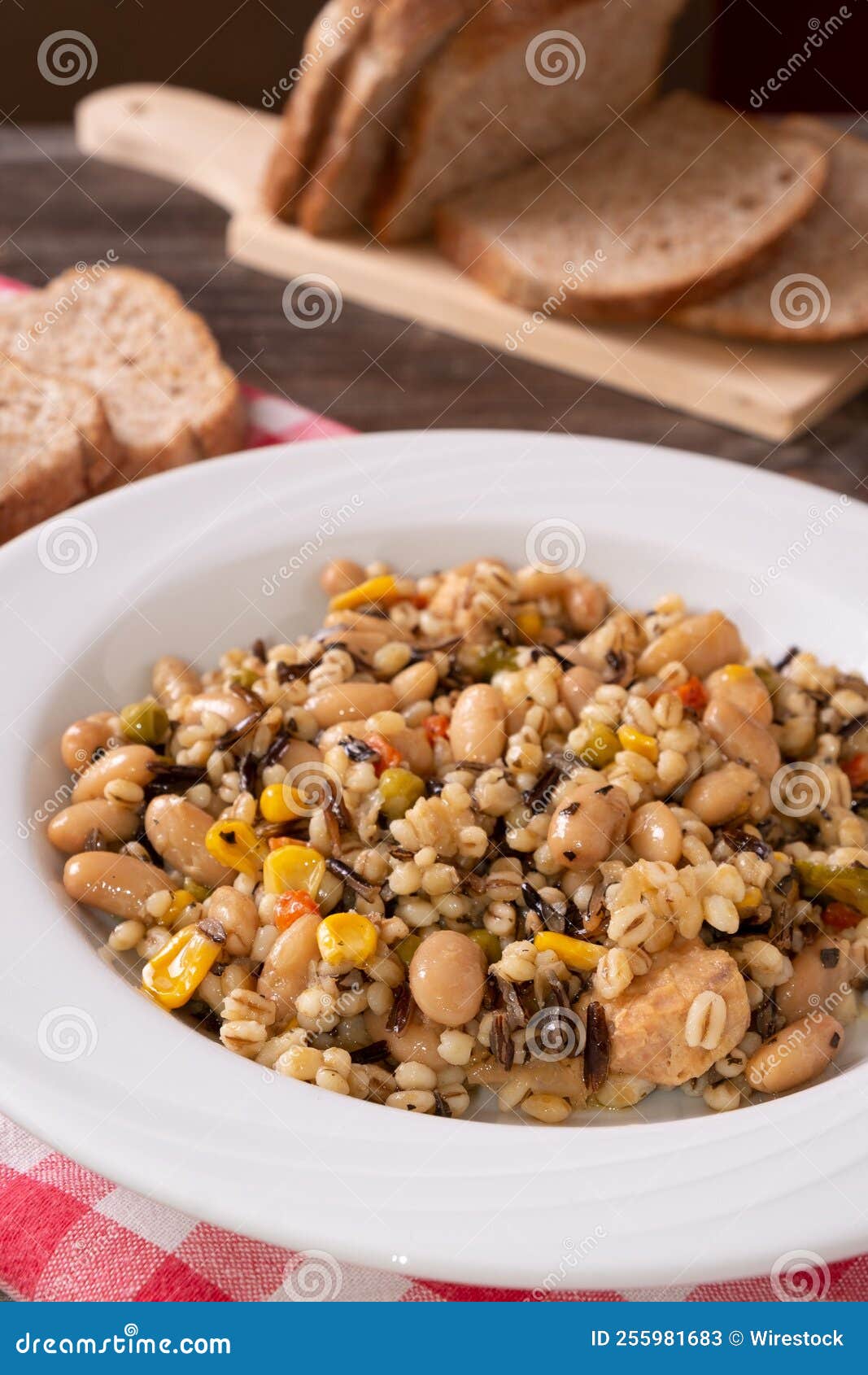 Chickpea, Tuna and Corn Salad Arranged on a Rustic Table with Bread