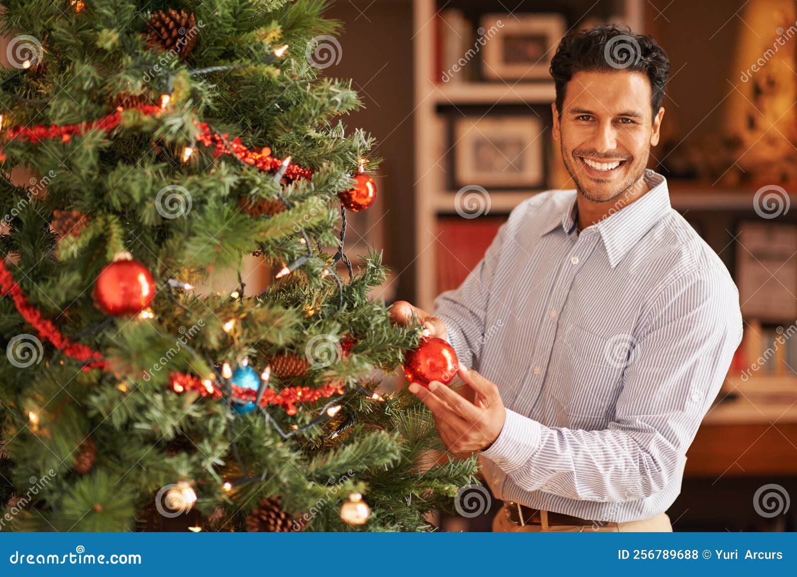 Chief in Charge of Christmas Tree Decorations. a Young Man Decorating