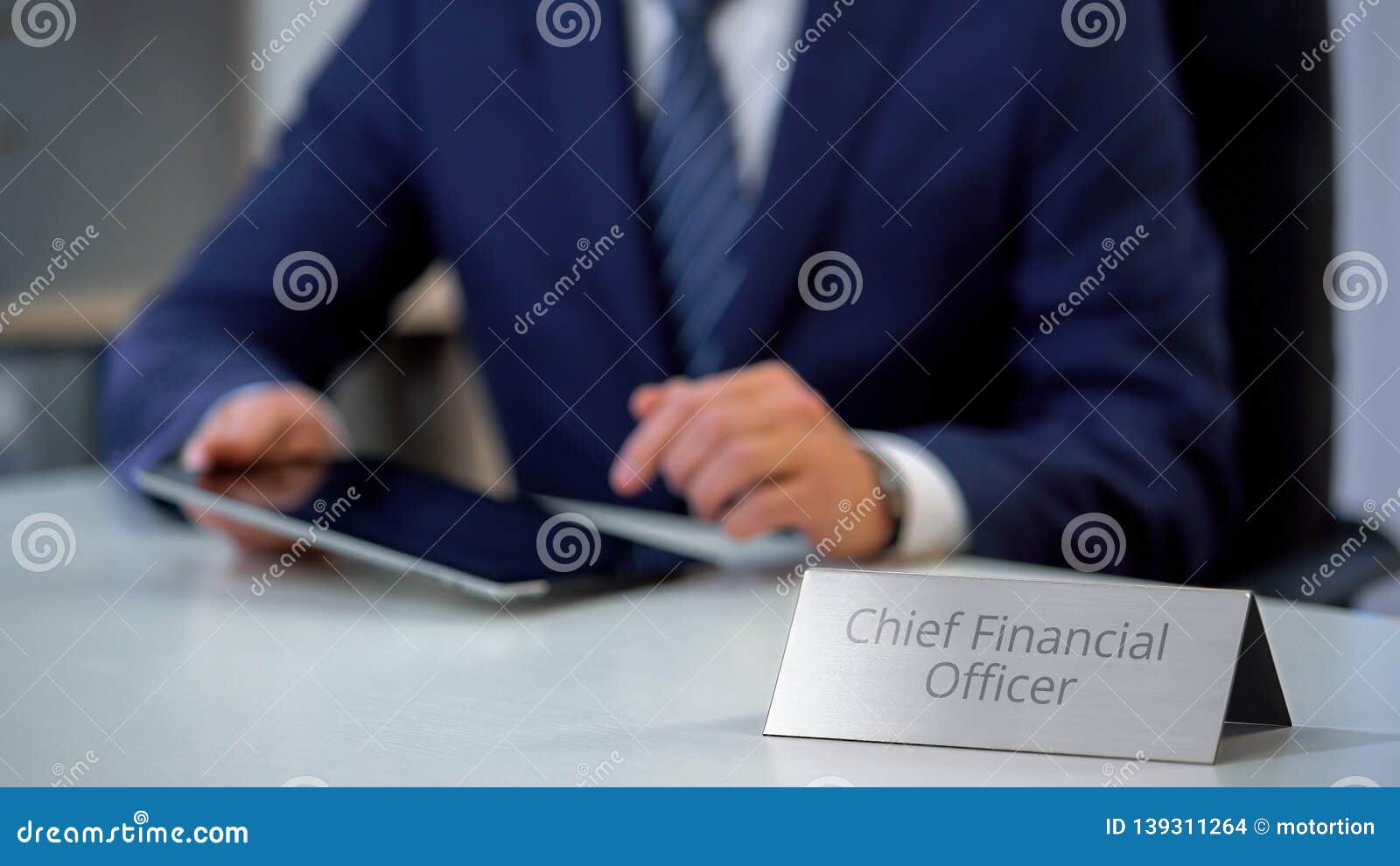 chief financial officer of corporation using tablet pc, planning company budget