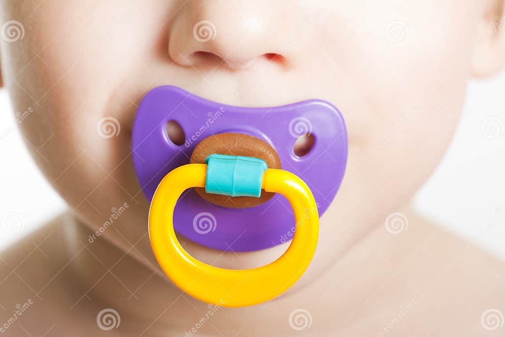 Child with baby pacifier stock image. Image of attractive 13801193