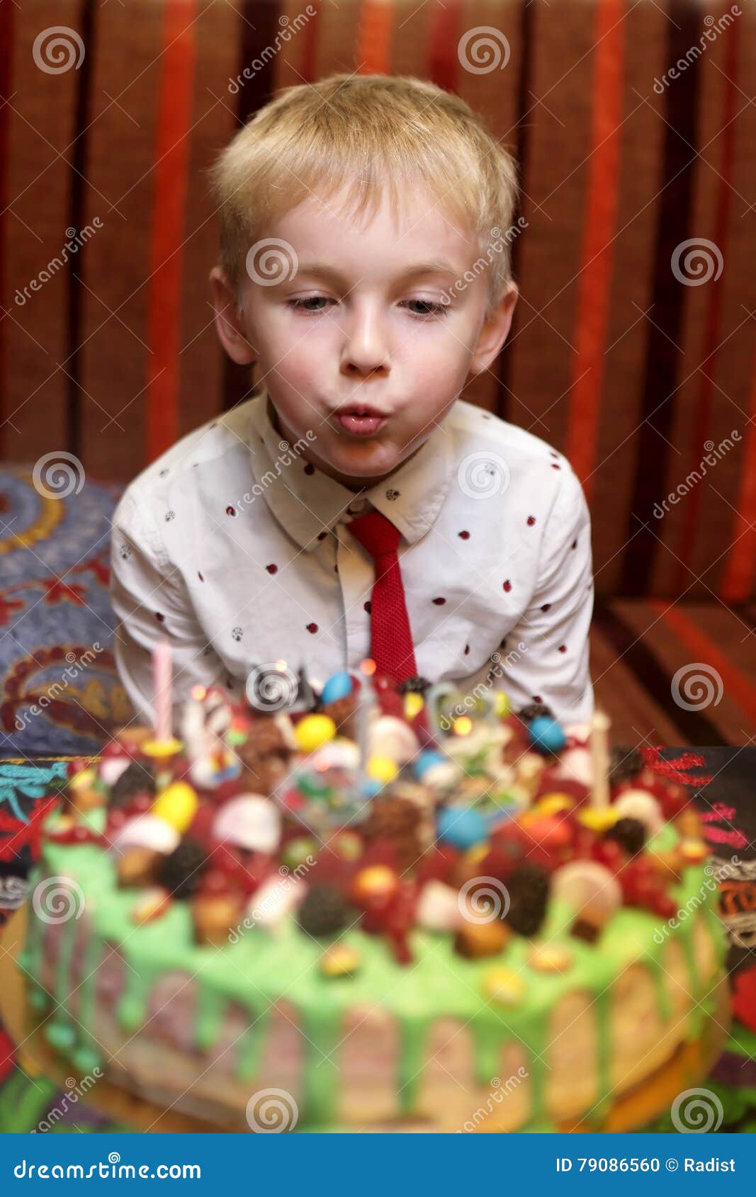 Child Blowing Out Candles on Birthday Cake Stock Photo Image of