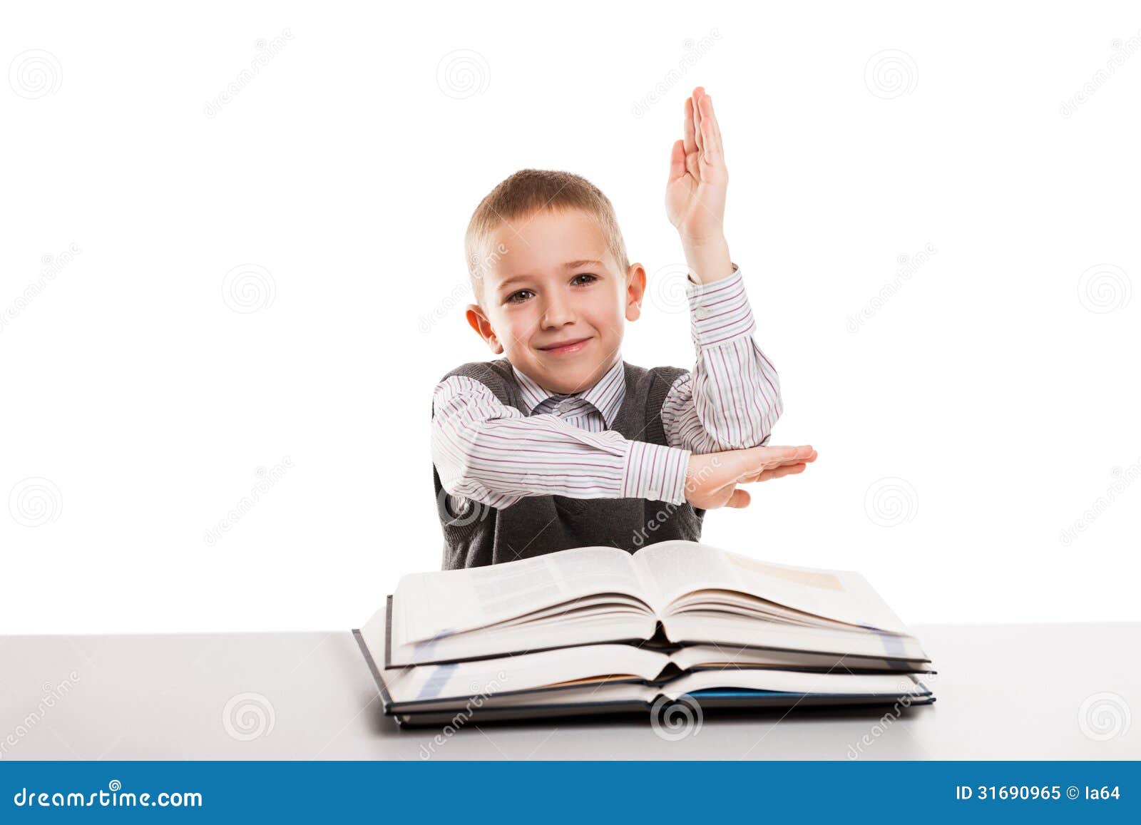 Child With Books At Desk Gesturing Hand Up For Answering School Stock Image - Image ...1300 x 957