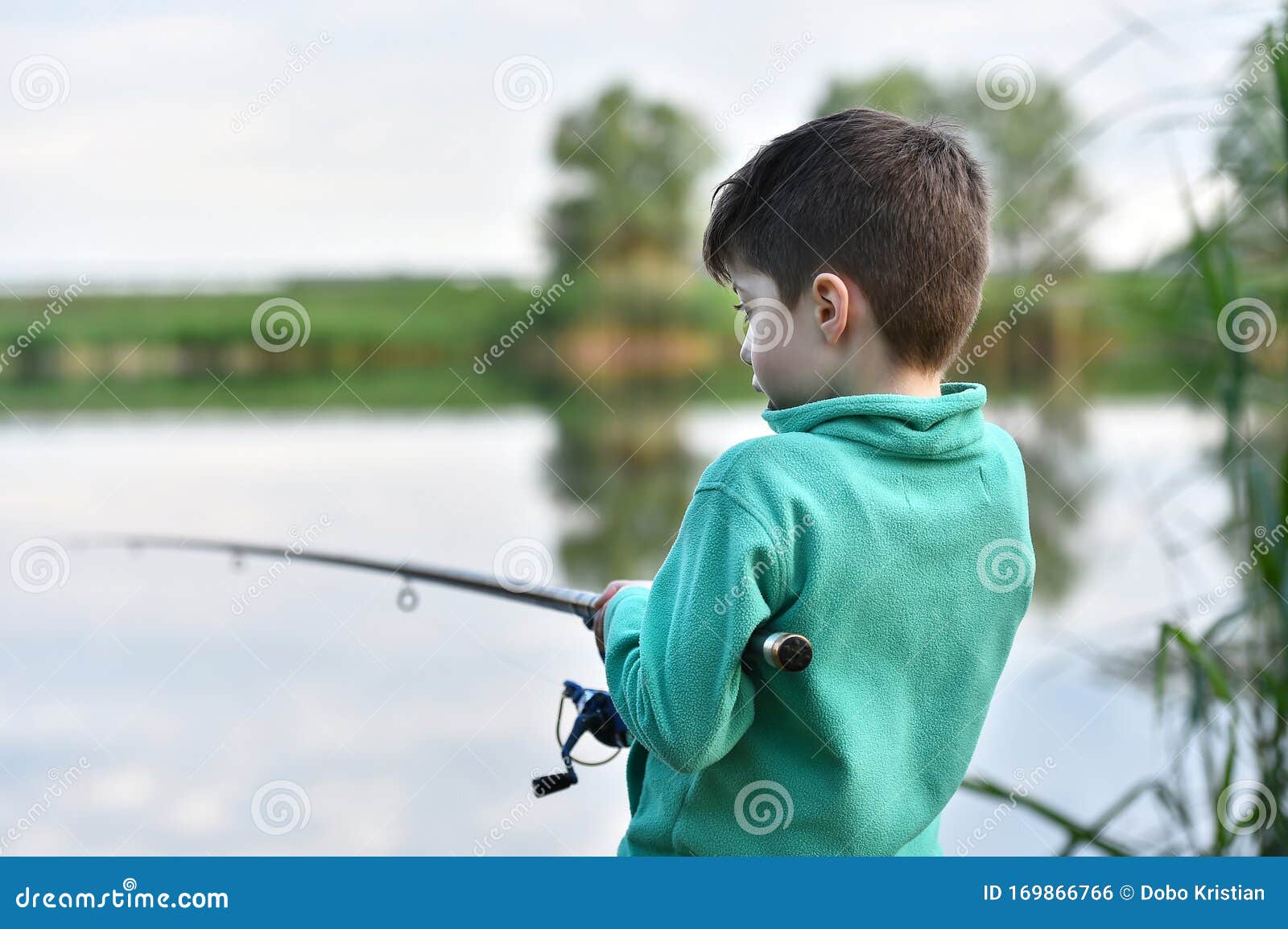Child Boy Holds Fishing Rod Stock Photo - Image of activity, rear: 169866766