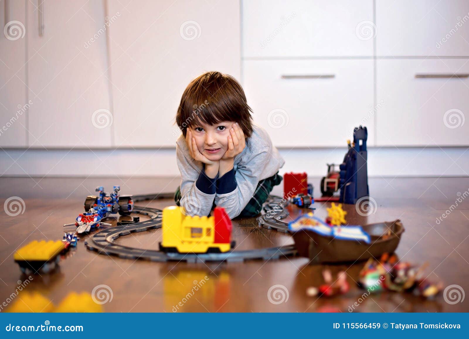 Child Boy Playing In Living Room With A Toy Train Stock Image Image