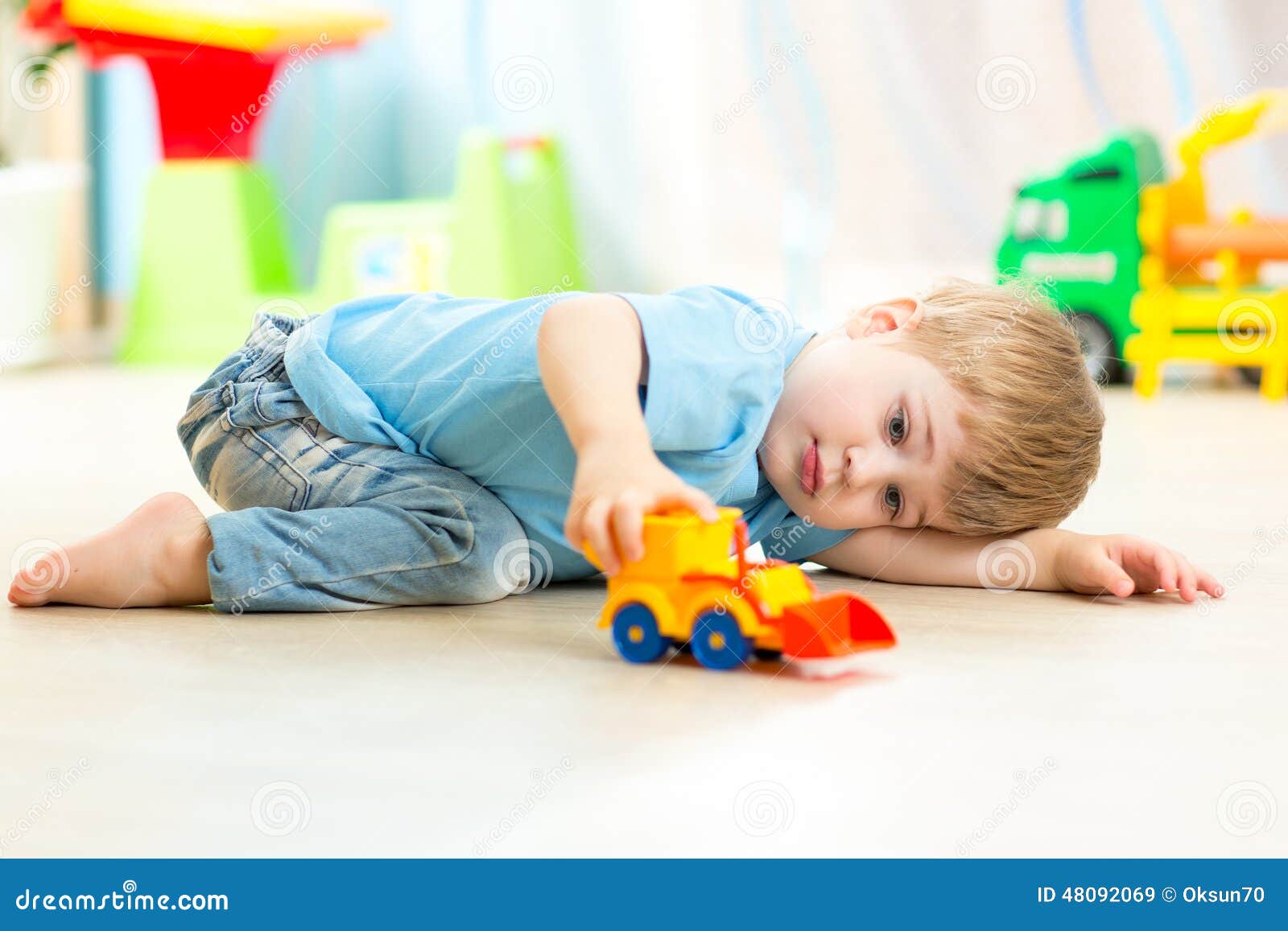 child boy toddler playing with toy car