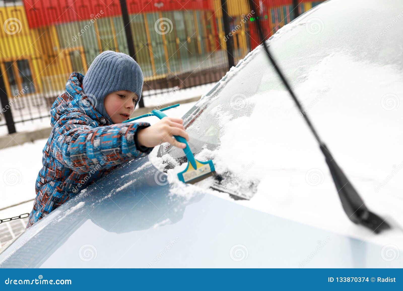 Child Brushing Snow Off Car Stock Photo Image of male, cold 133870374