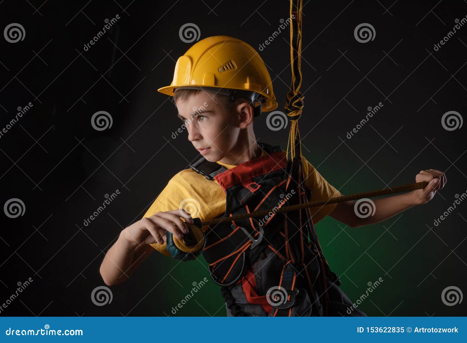 child the builder costume posing with a work tool