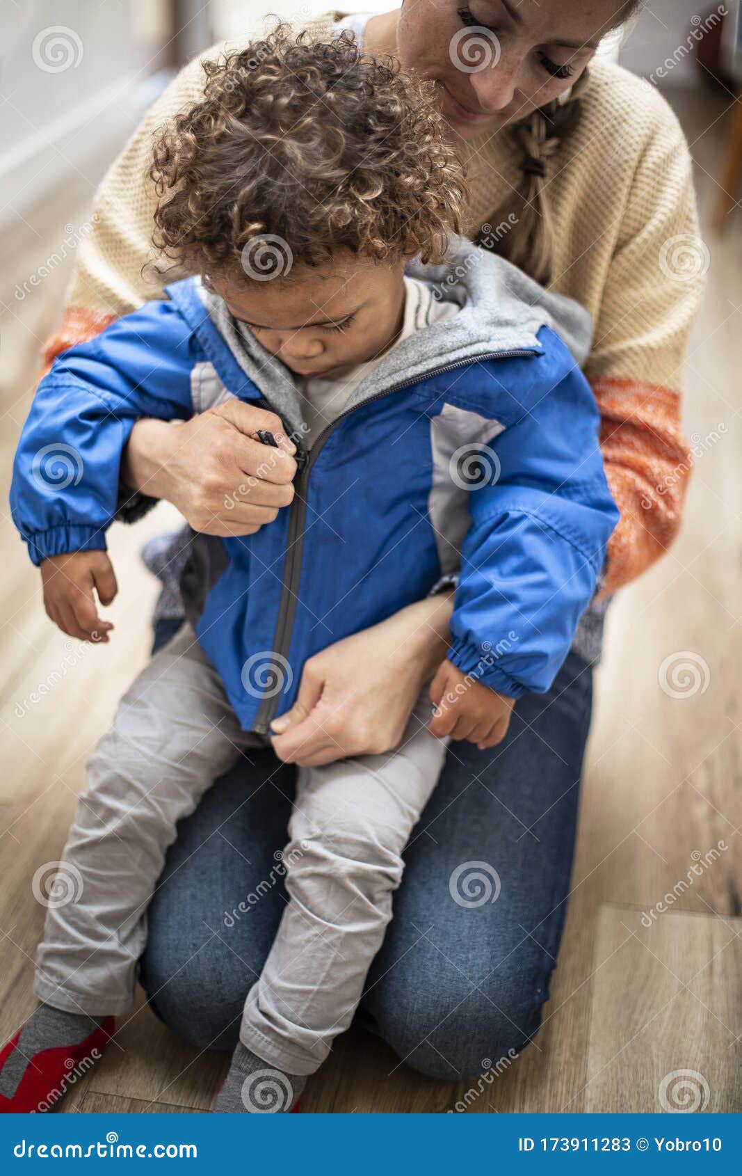 Child Putting On Jacket