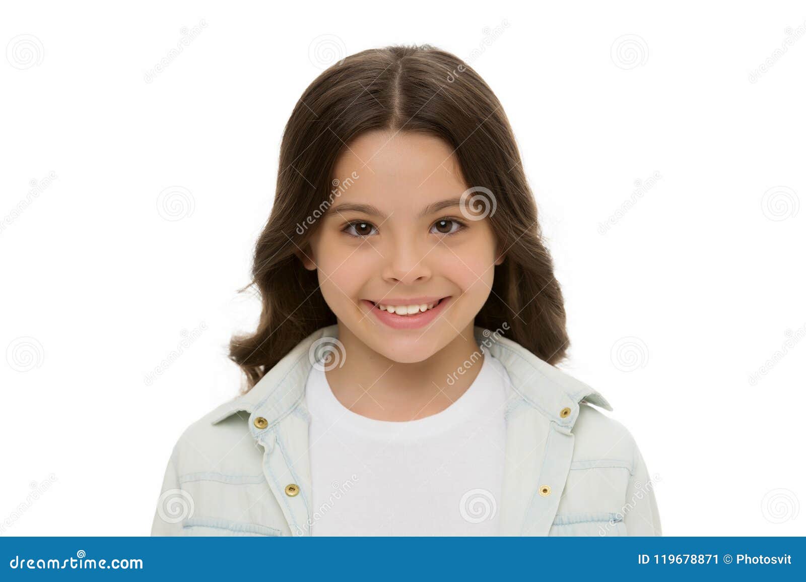 child charming smile  white background close up. charming cutie. kid girl long curly hair posing cheerful happy