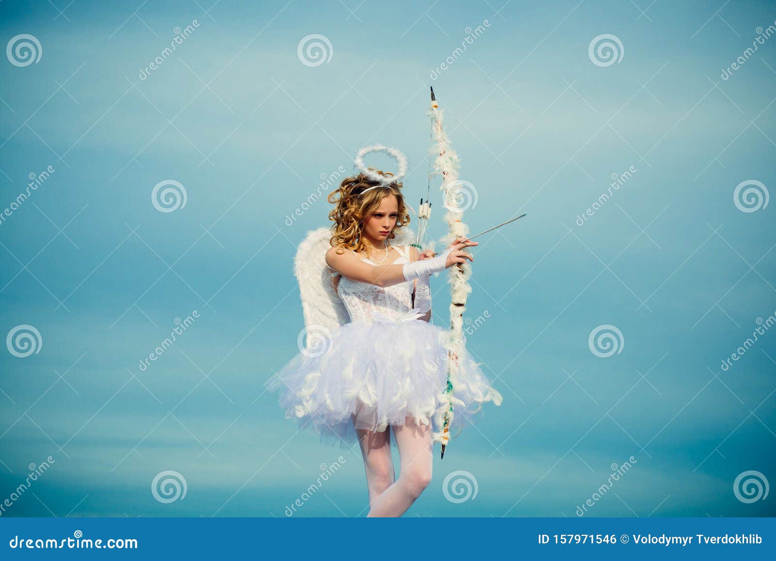 A Child in the Clothes of an Angel on Sky Background - Valentine ...