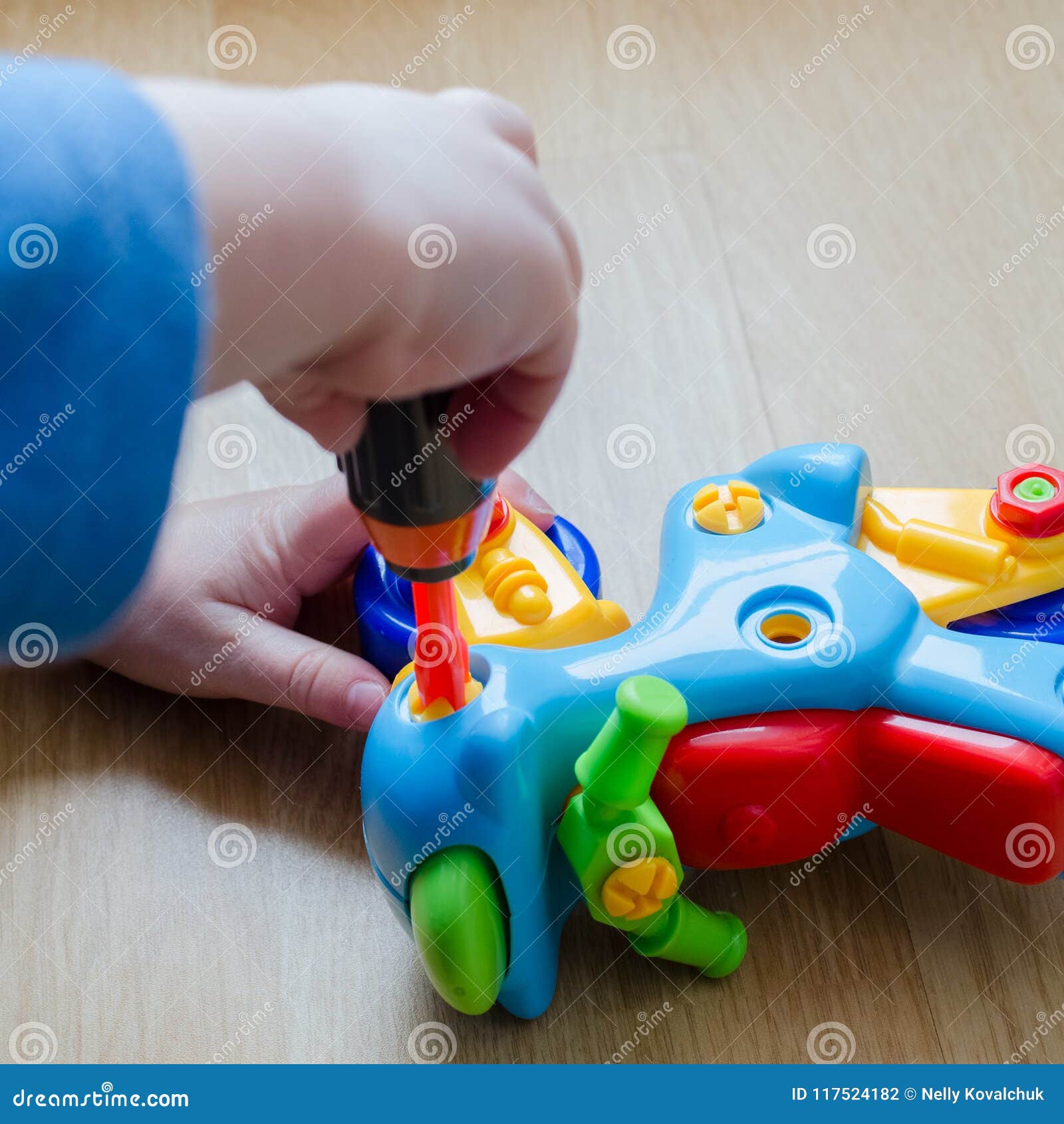 The Child is Collecting a Toy Motorcycle. Stock Photo - Image of child ...