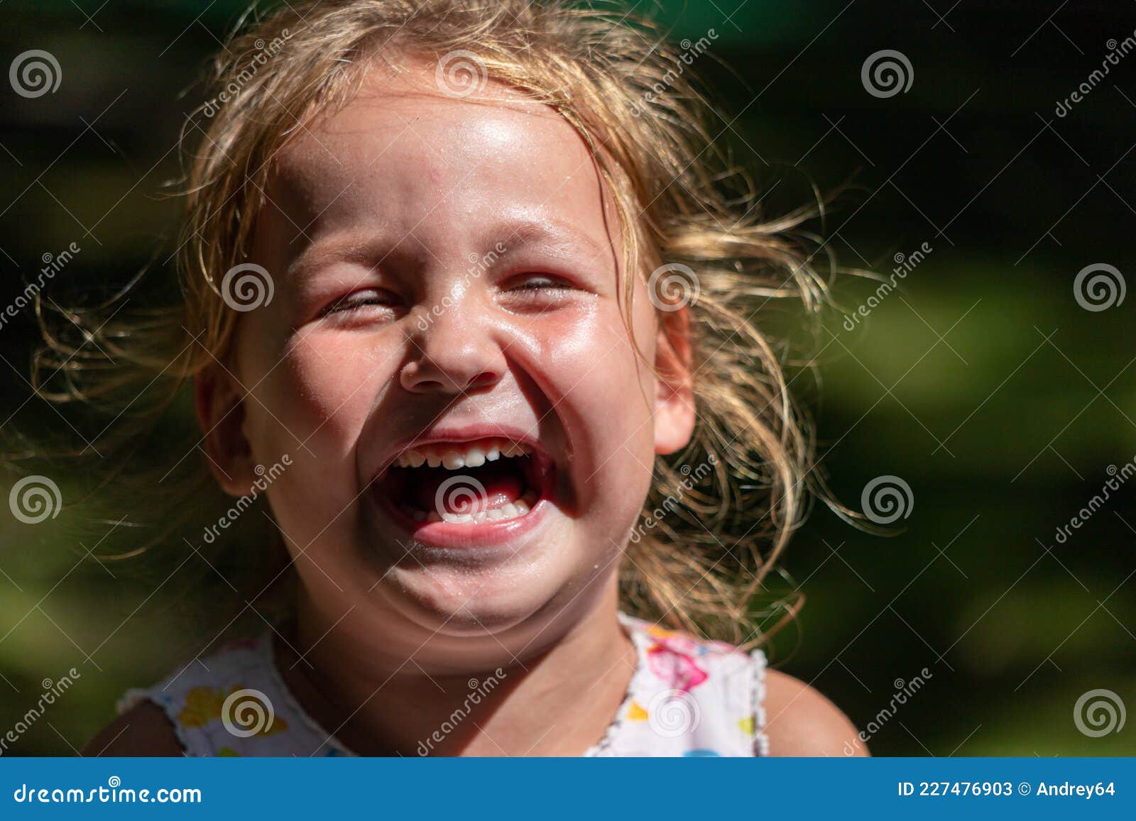 The Child is Crying and Laughing, the Child is Hysterical Stock Image