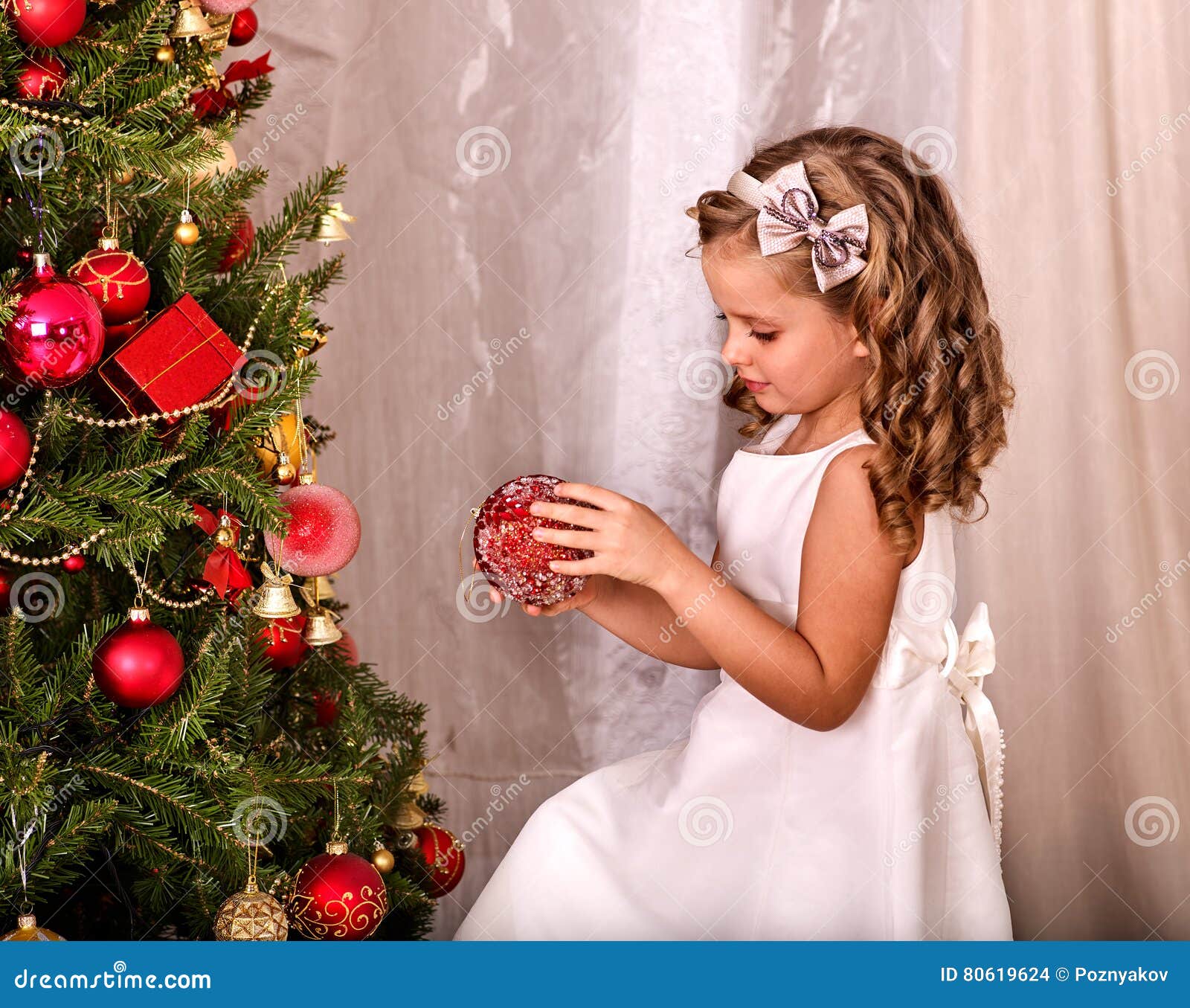 Child Decorate On Christmas Tree Home Alone. Stock Photo - Image of child, decorate: 80619624