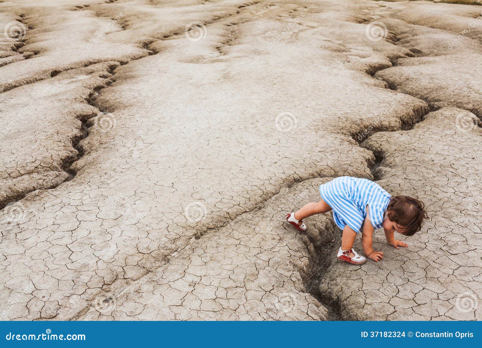 Child in a desert land stock photo. Image of dried, soil 37182324
