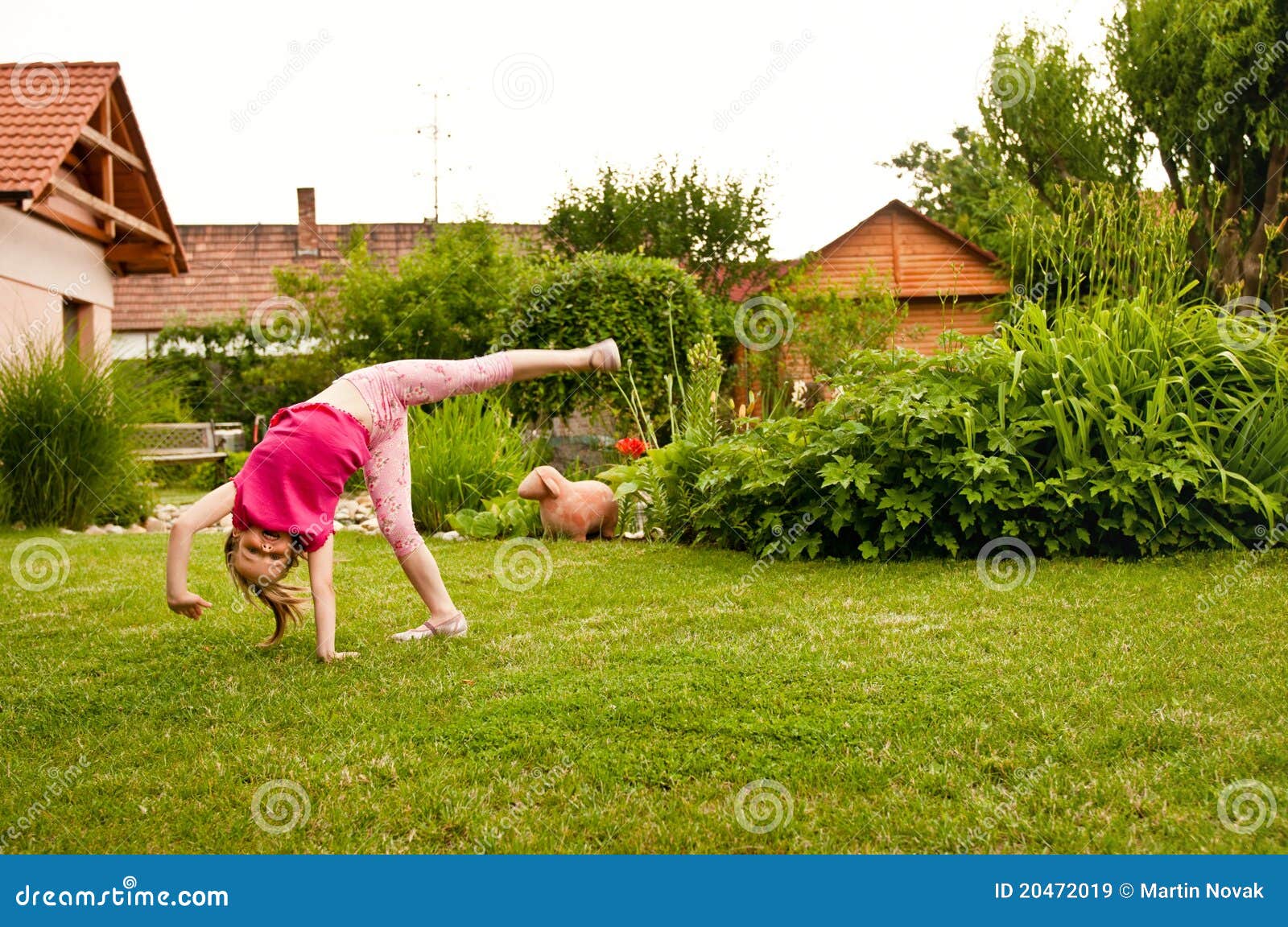 Child doing cartwheel stock image. Image of garden, lifestyle 20472019
