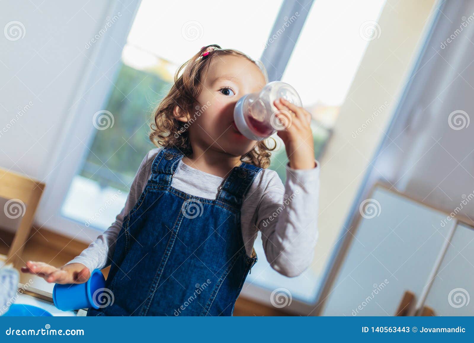 Child Drinking Juice from Bottle Stock Image Image of person, face