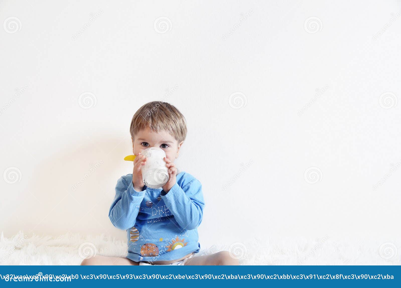 A child drinking yogurt stock photo. Image of activity 87964178