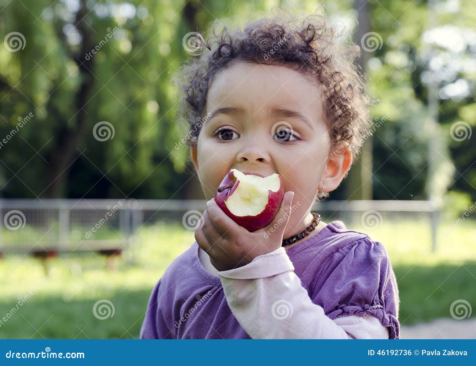 child eating apple