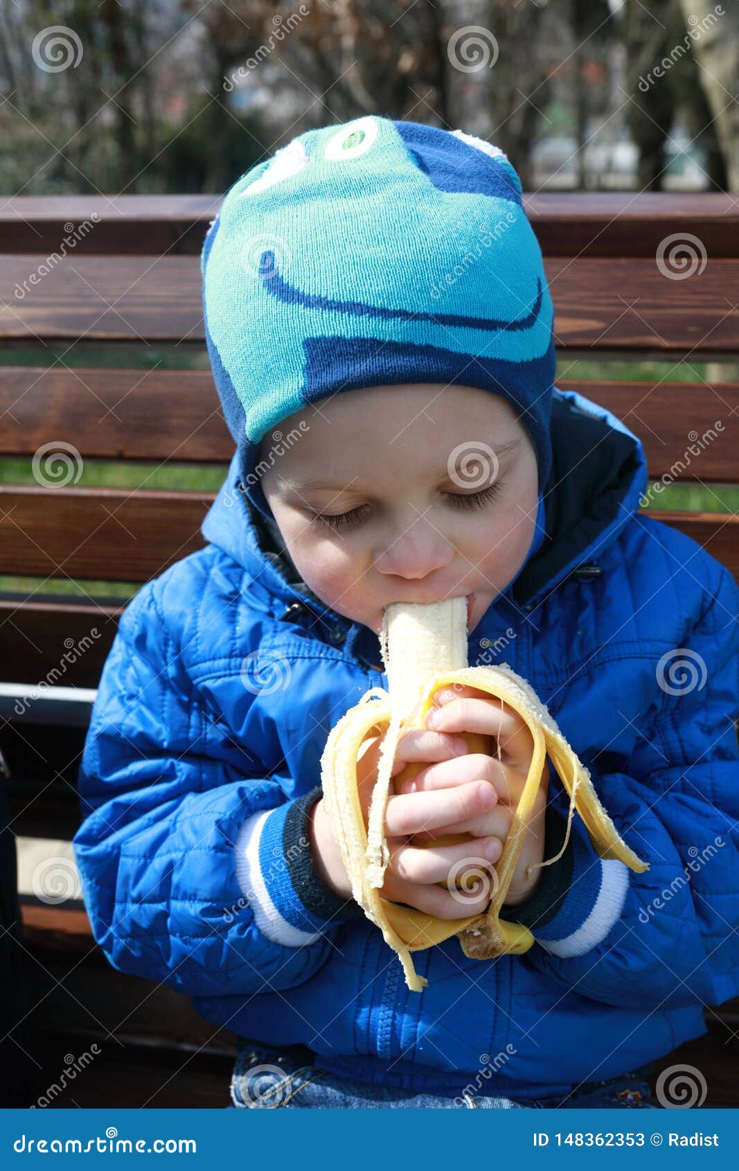 Child eating banana stock image. Image of banana, natural 148362353