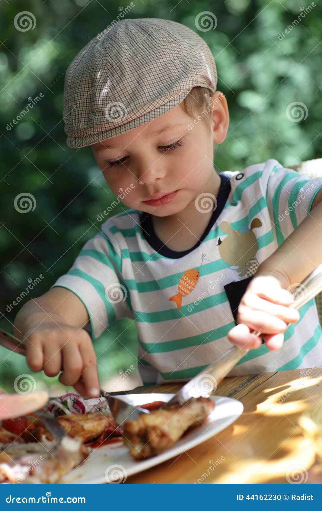 Child eating chicken stock photo. Image of color, fork 44162230