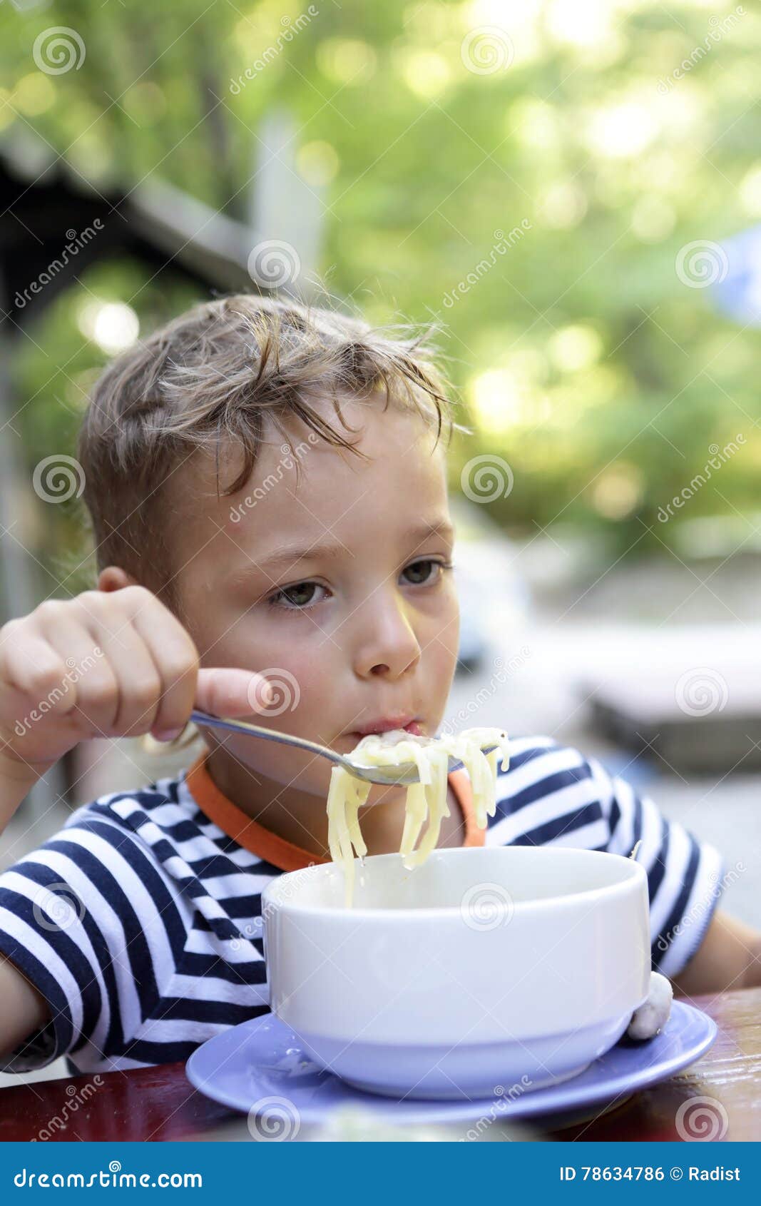 Child eating chicken soup stock photo. Image of concept 78634786
