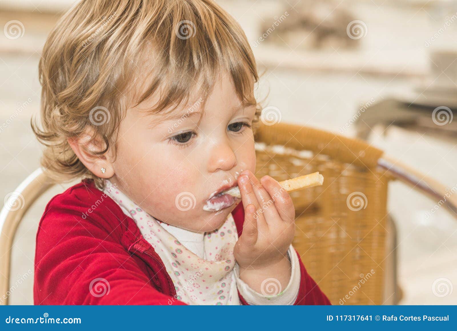 Child eating chips stock image. Image of food, hungry 117317641