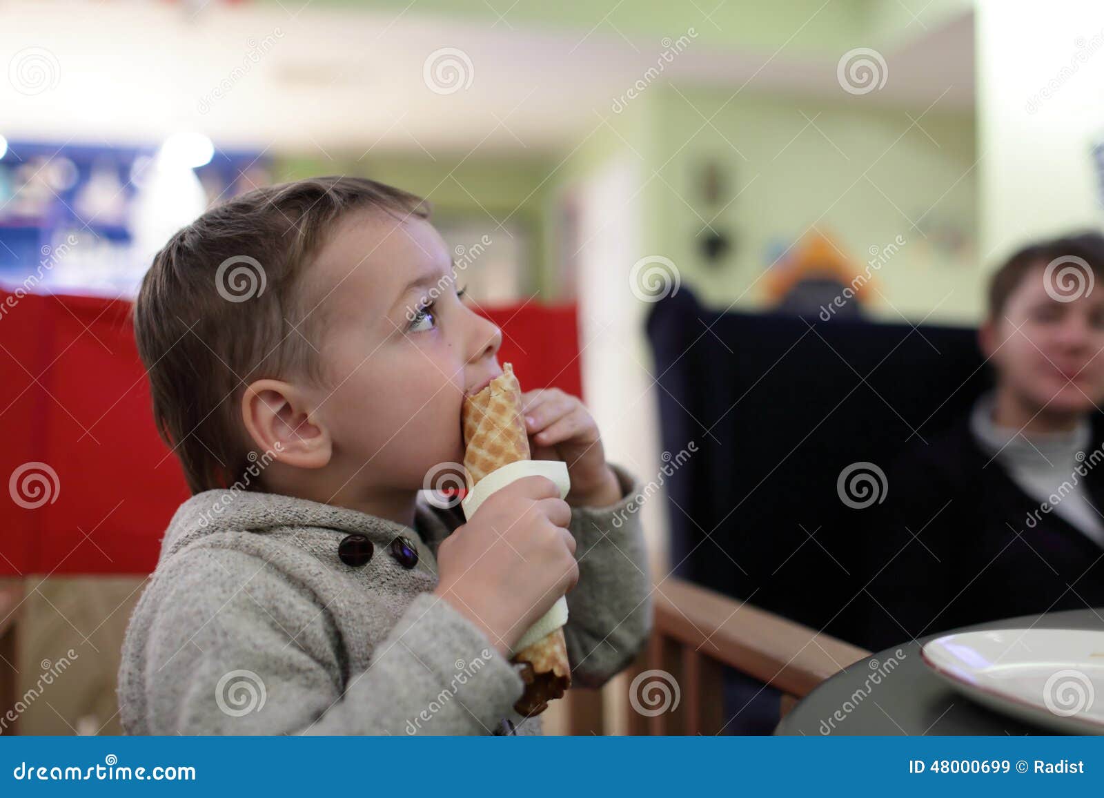 Child eating wafer stock image. Image of holding, cream 48000699