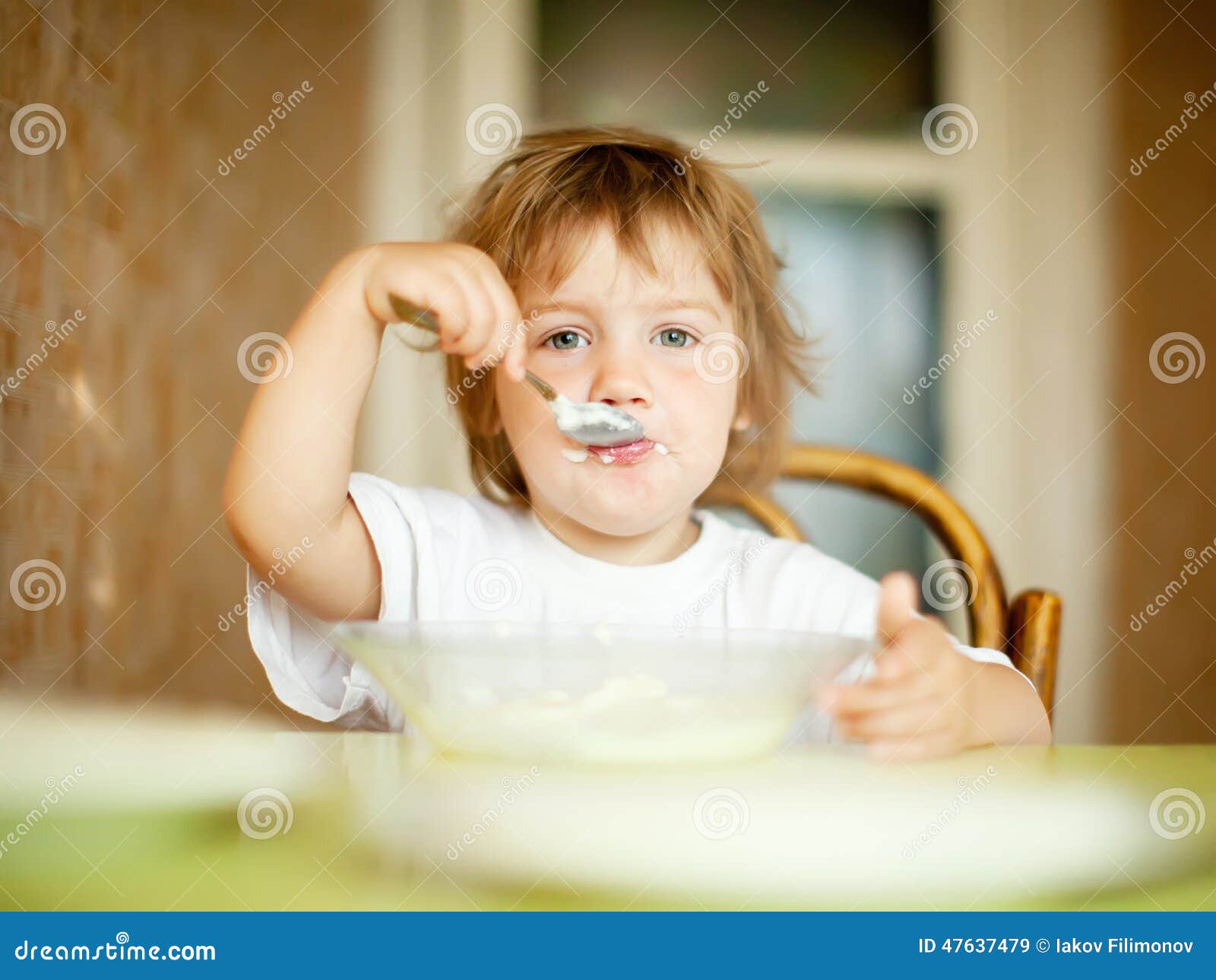 Child Eats from Plate with Spoon Stock Image Image of spoon
