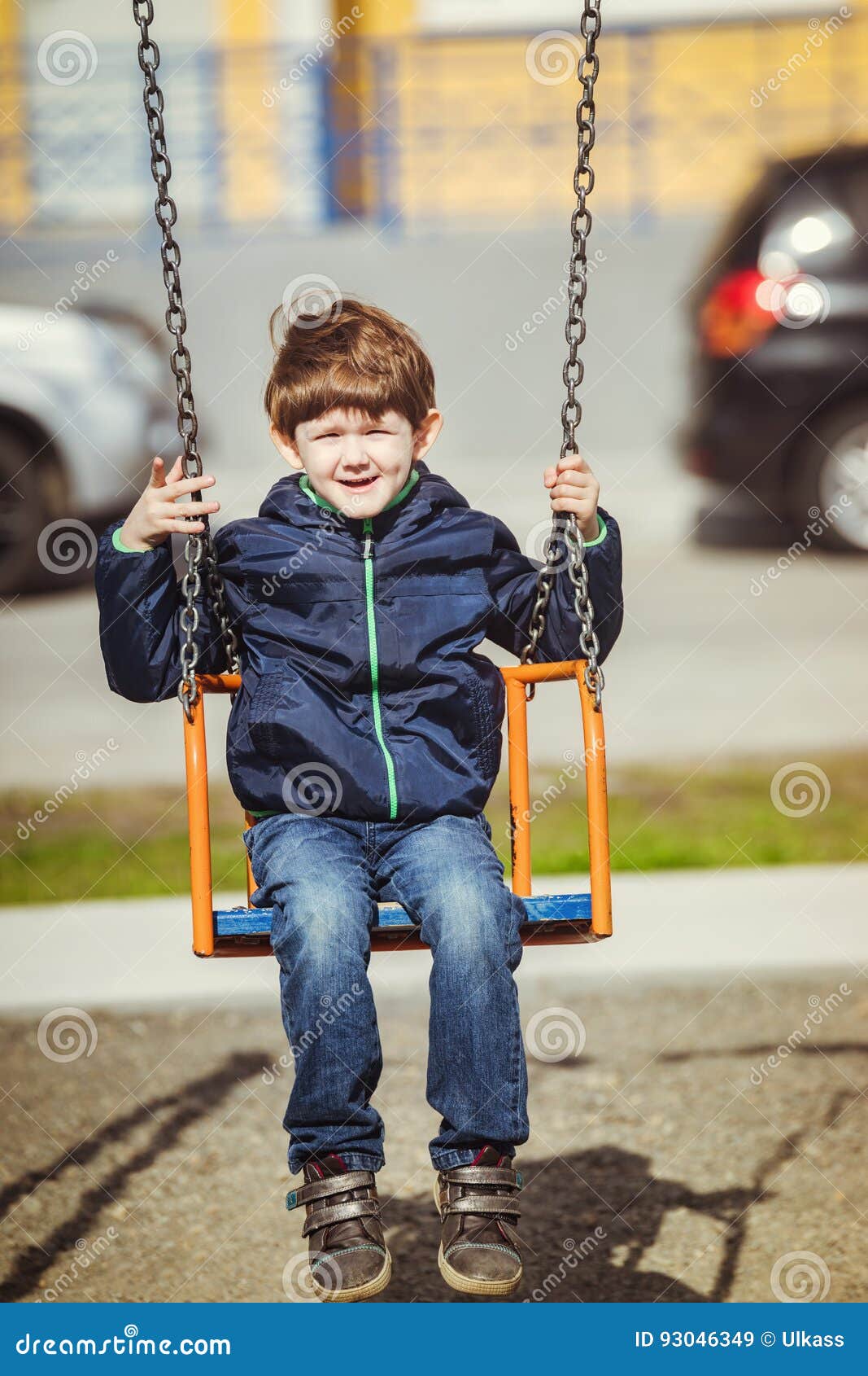 Child enjoy on swing, spring outdoors. Little boy enjoy on swing, spring outdoors.