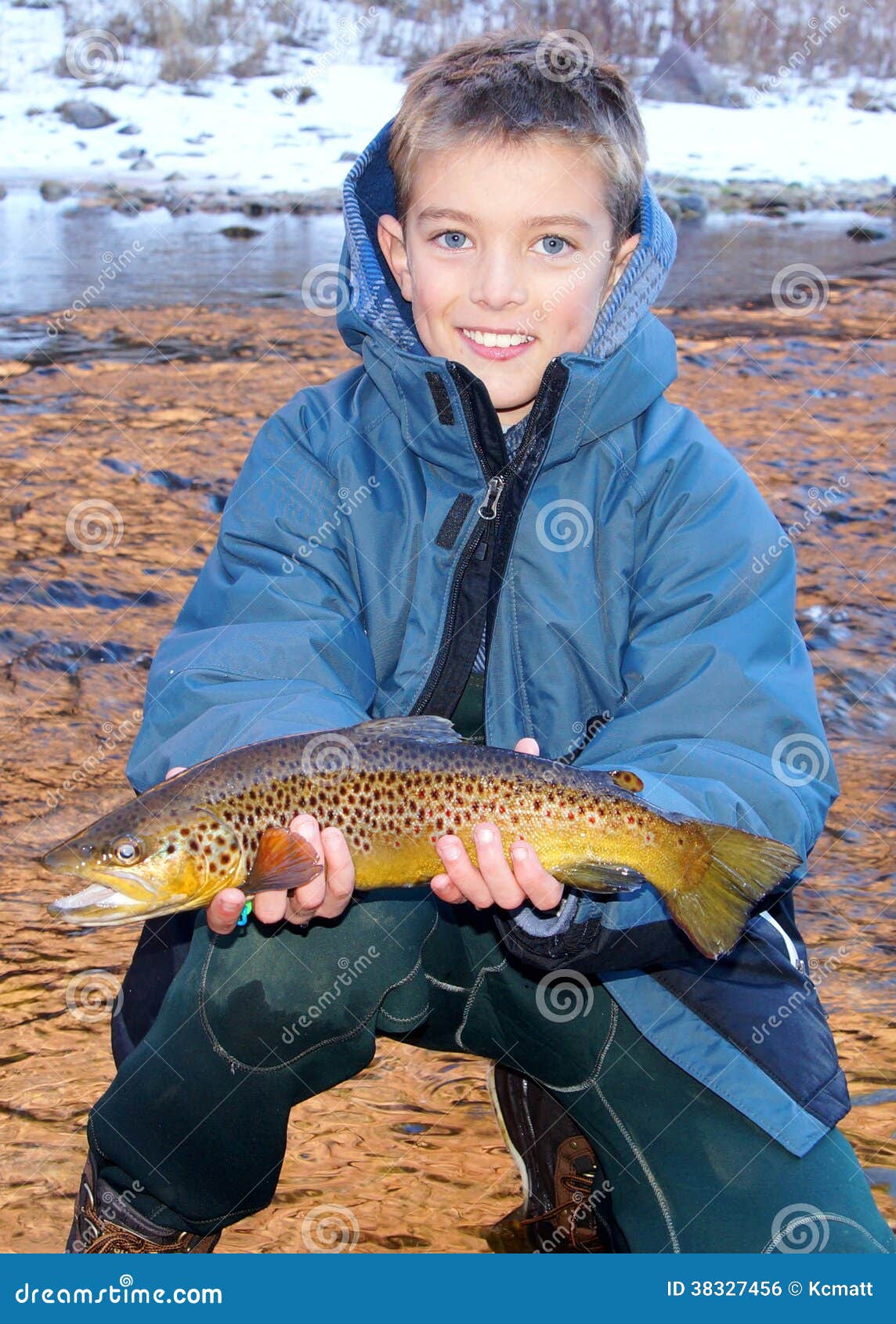 Young Man Hold Big Rainbow Trout in His Hands. Stock Image - Image