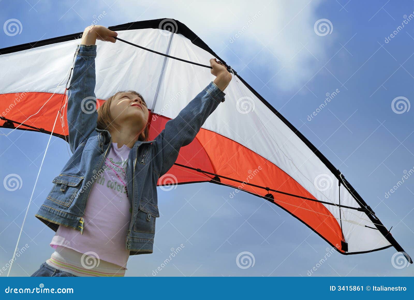 child flying with a kite