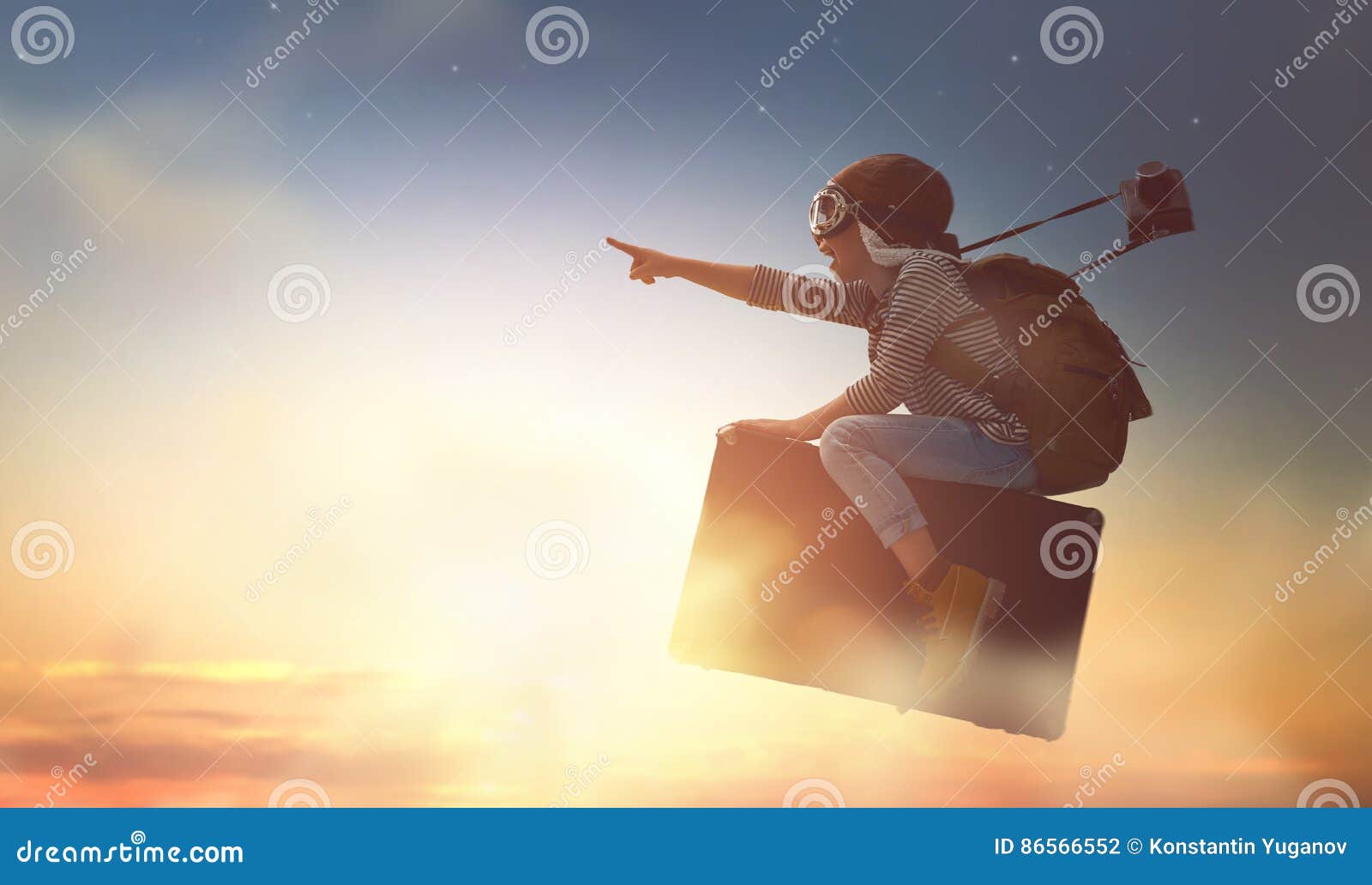 child flying on a suitcase
