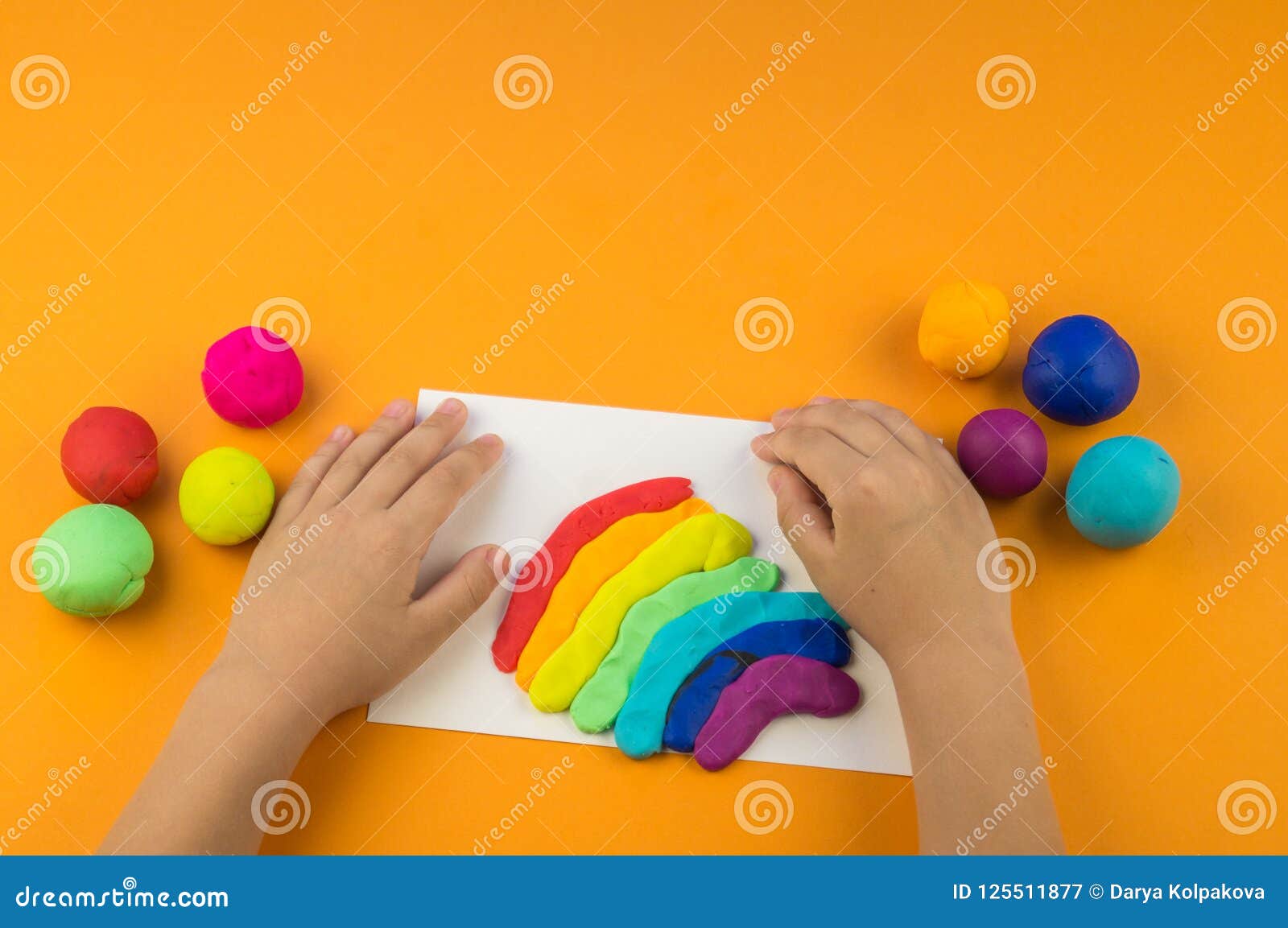 Child Mold from Colored Plasticine.Children`s Hand Stock Image Image