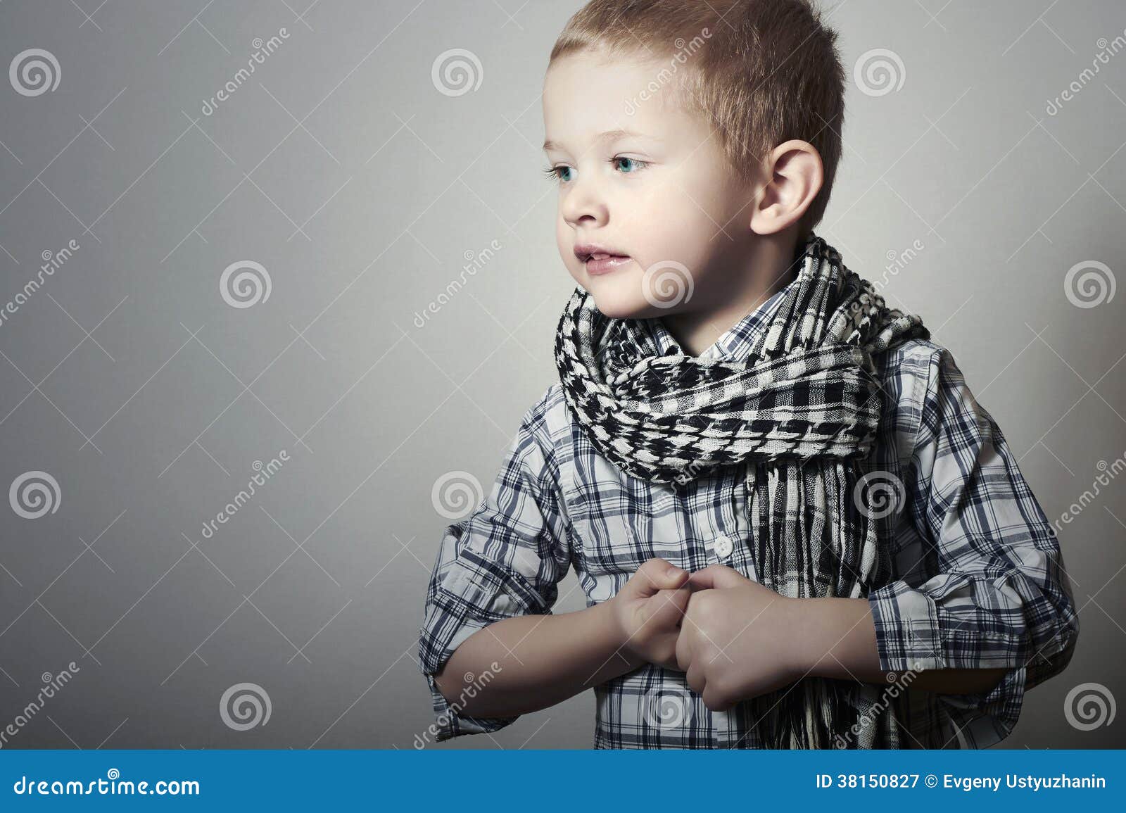 child. funny little boy in scurf. fashion children. 4 years old. plaid shirt