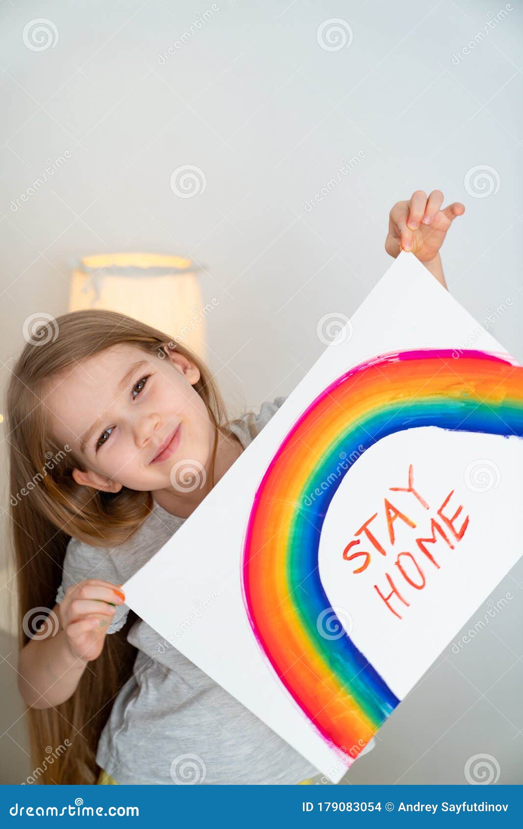 child girl drew rainbow and poster stay home.