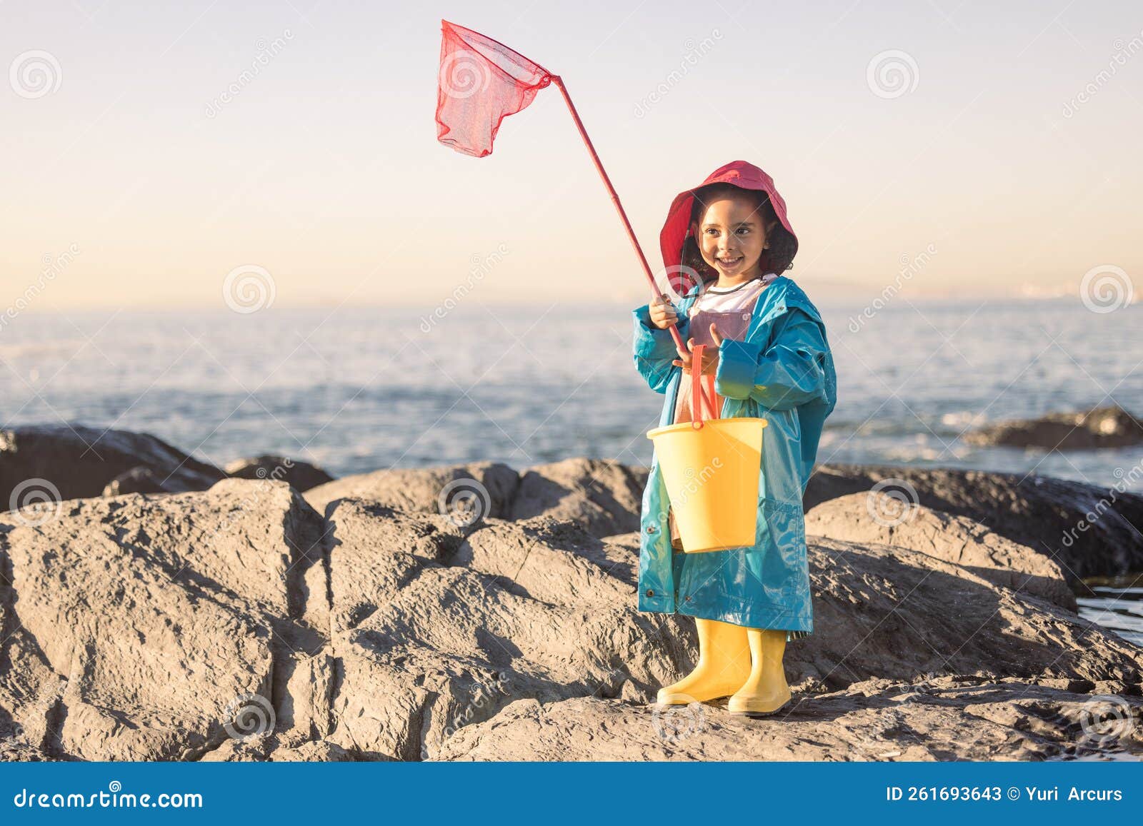 Child, Girl or Kid Fishing Net or Bucket by Beach Rock Pools
